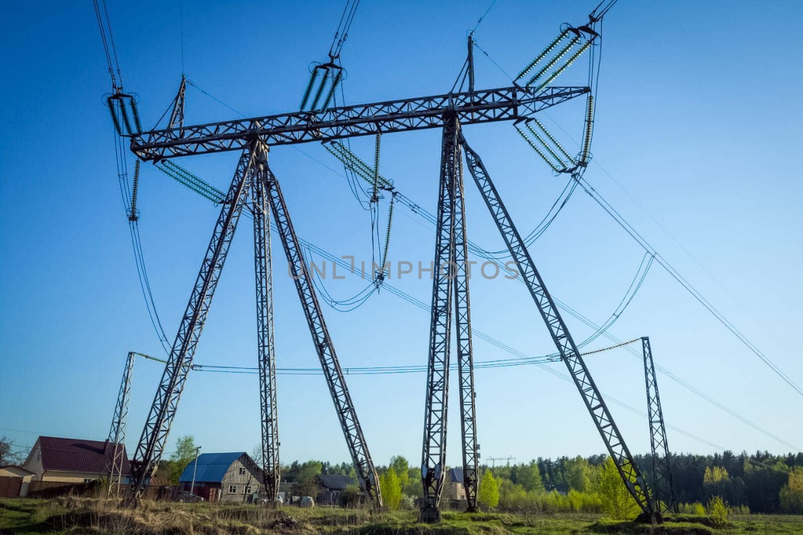 Power line supports. Electricity transmission and posts.
