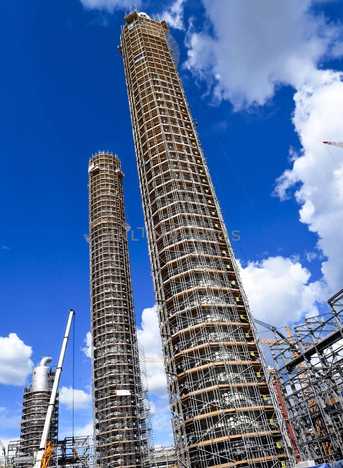 Cracking and reforming columns at a petrochemical plant Petrochemical and refinery, industrial landscape view of the plant.
