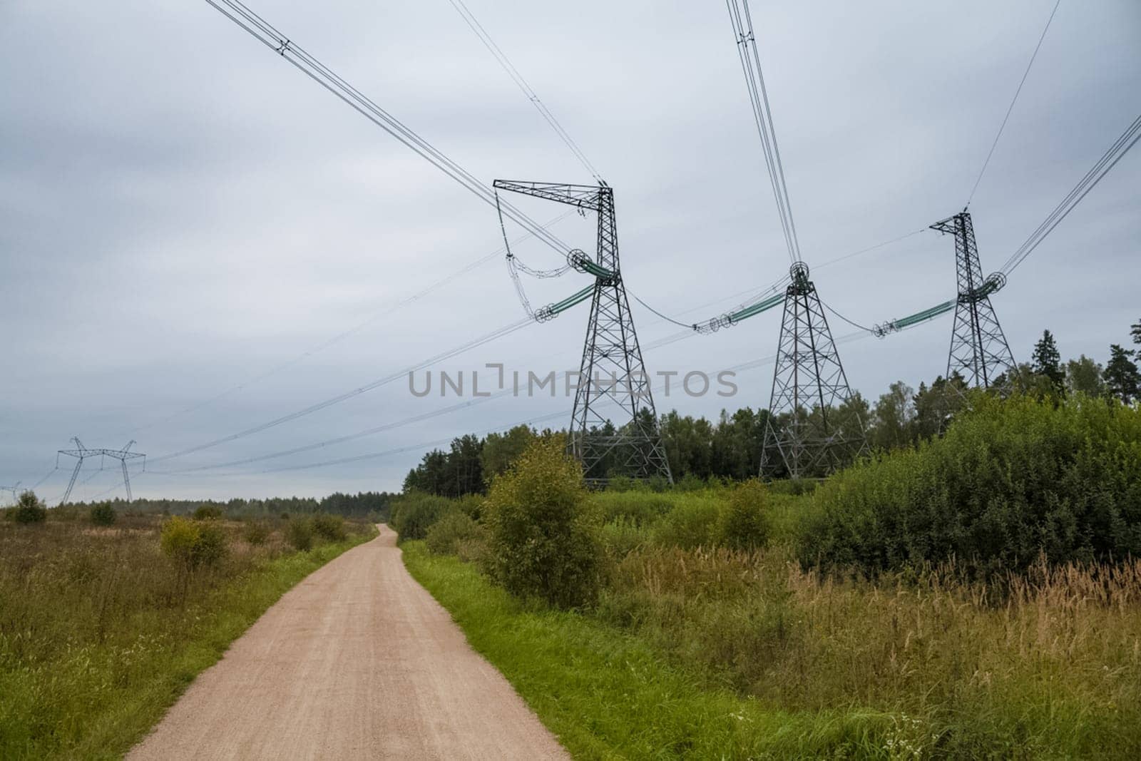 Power line supports. Electricity transmission and posts.