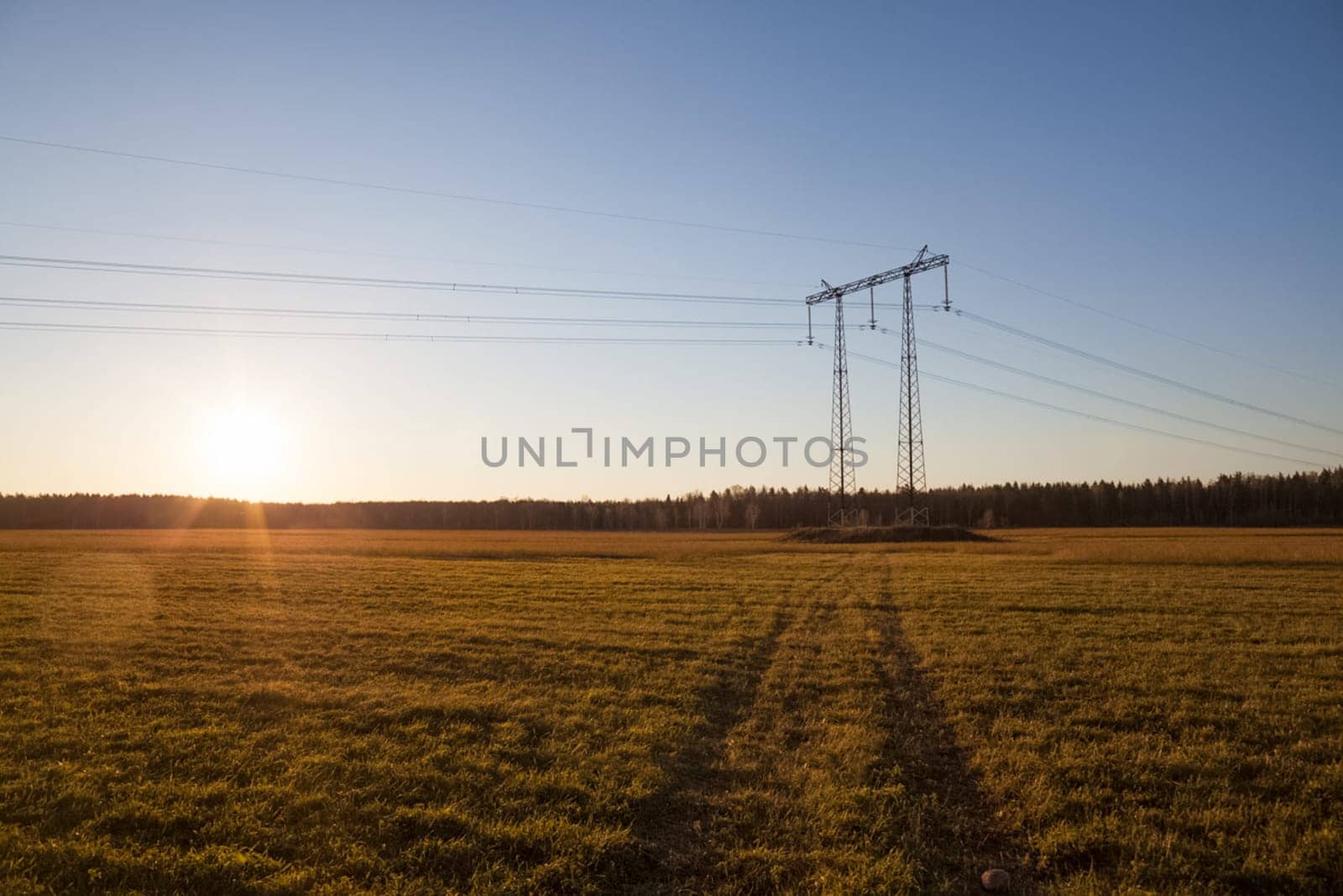 Power line supports. Electricity transmission and posts.