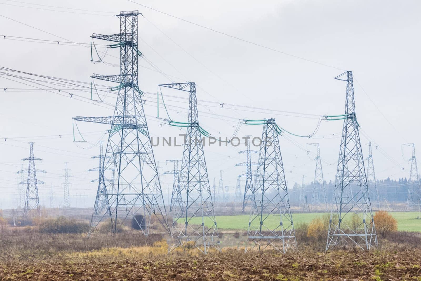 Power line supports. Electricity transmission and posts.