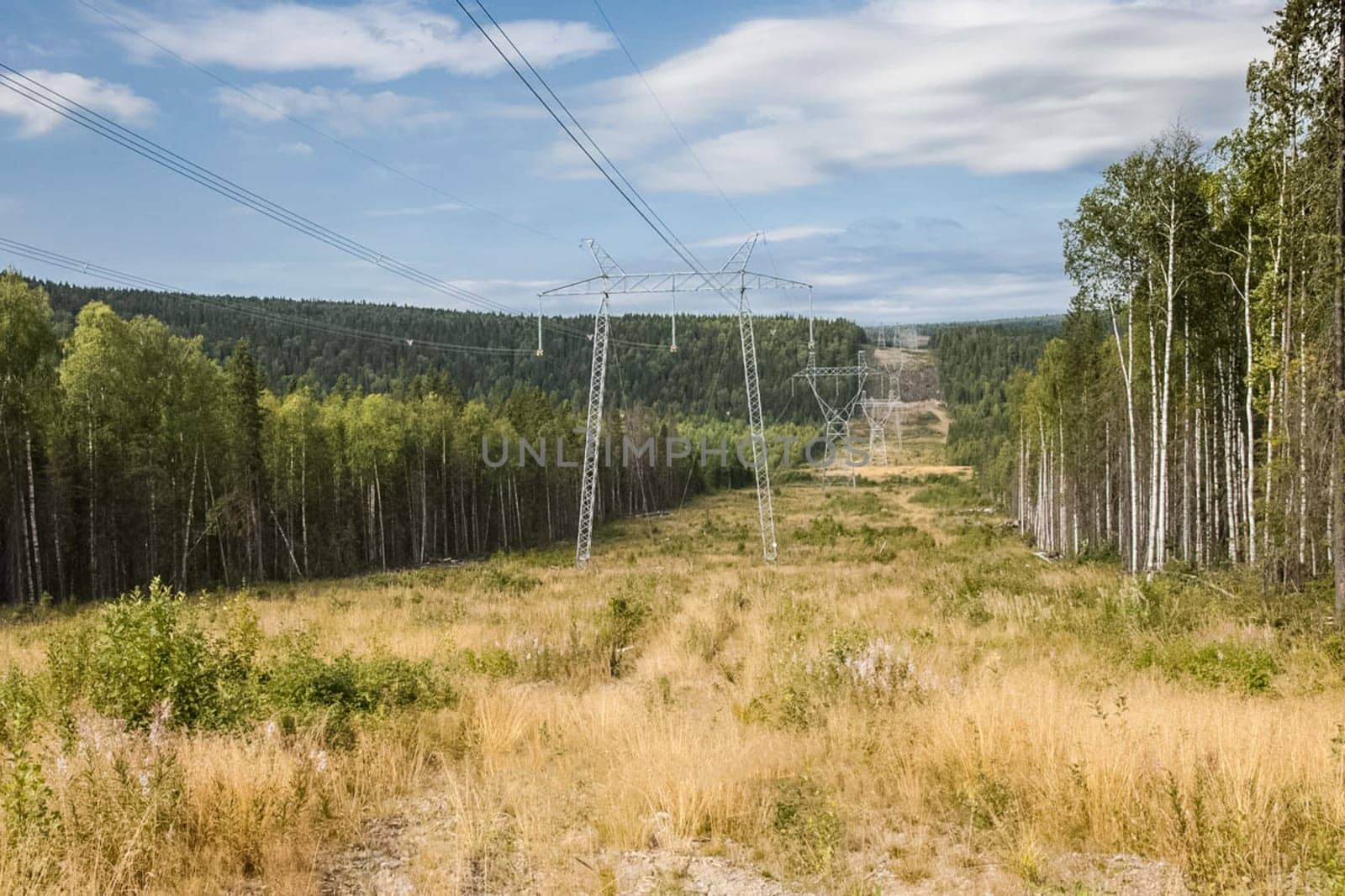 Power line supports. Electricity transmission and posts.
