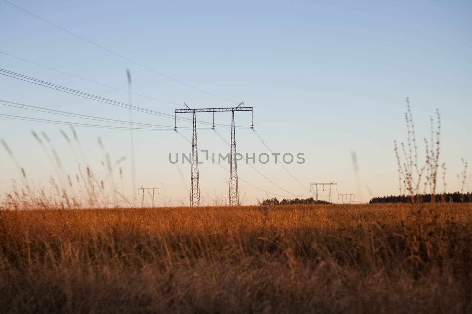 Power line supports. Electricity transmission and posts.