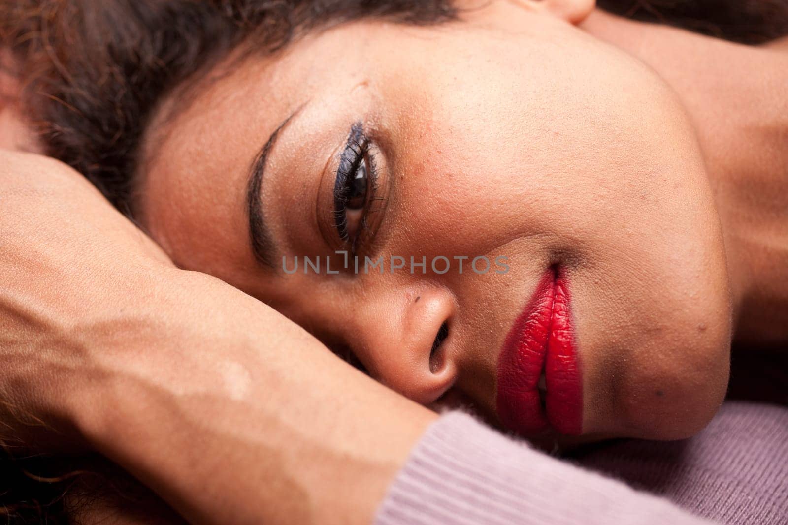 wonderful african-american woman lying on a sofa relaxing
