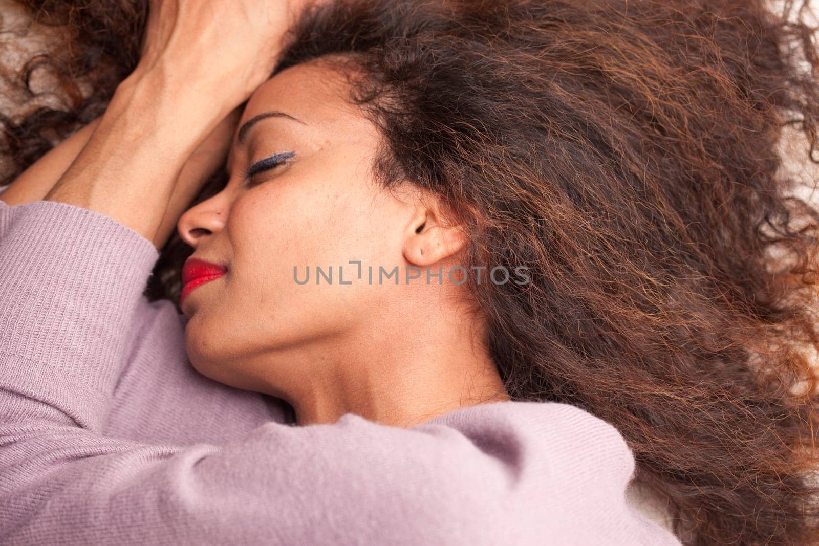 wonderful african-american woman sleeping on her sofa