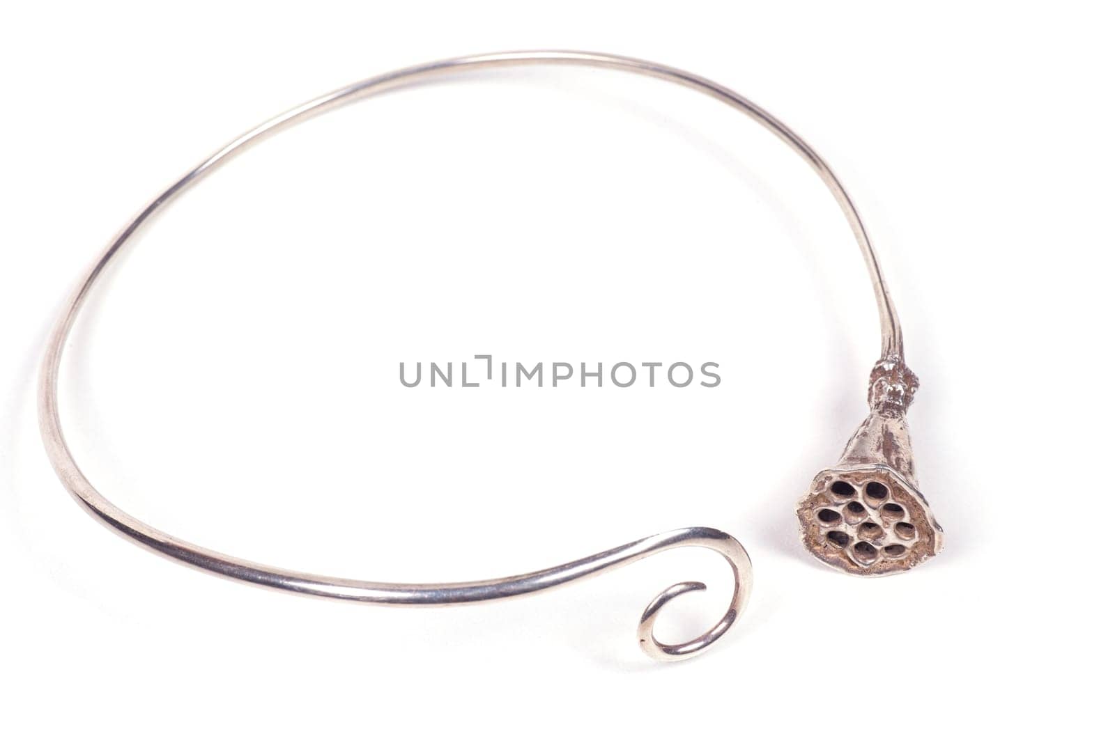 Close up of silver necklace isolated on white background, manufactured by Ornella Salamone
