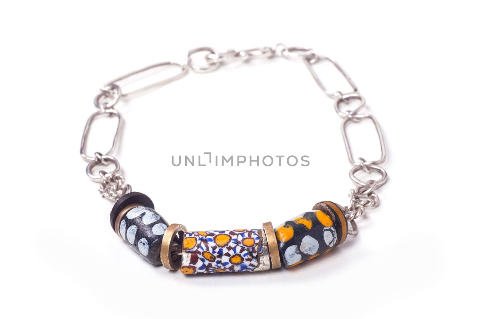 Close up of silver and painted stone necklace isolated on white background, manufactured by Ornella Salamone