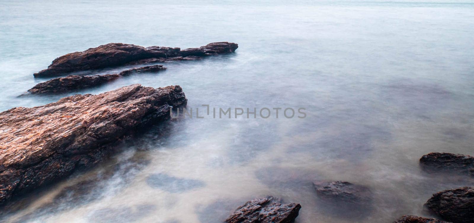 Long Exposure of Sea with Smooth Wave and Rock landscape. Nature of Seascape vacation holiday season time for relax travel