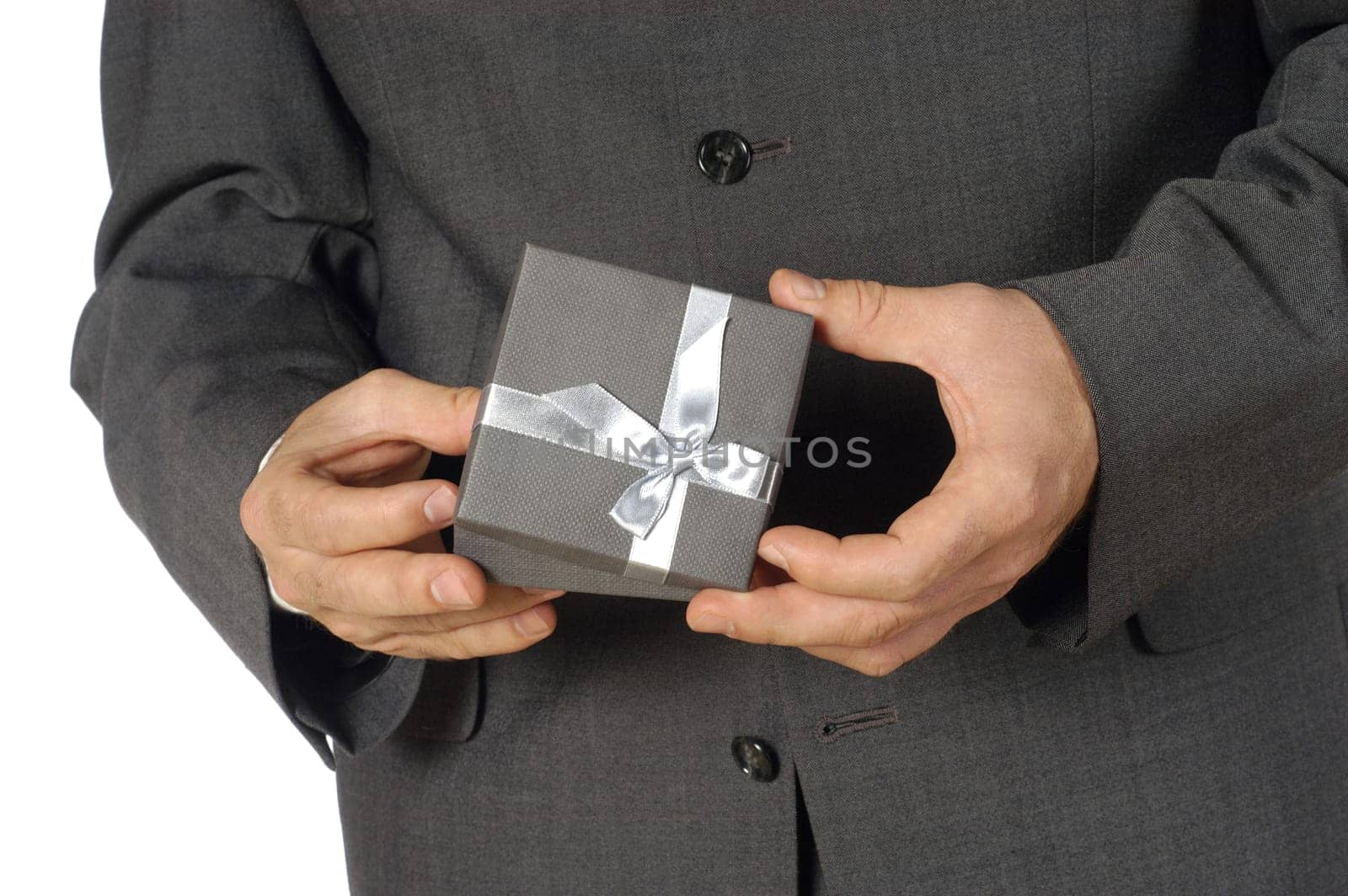 Mid section view of a businessman holding a gift