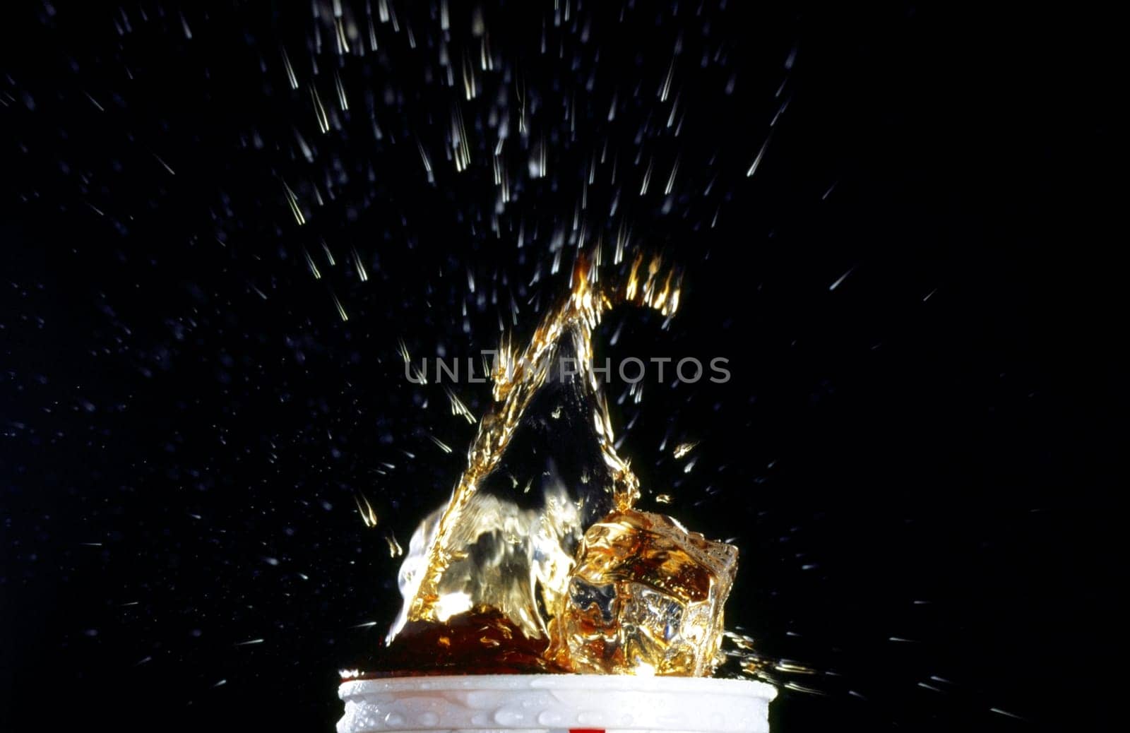 Close-up of water splashing out of a glass