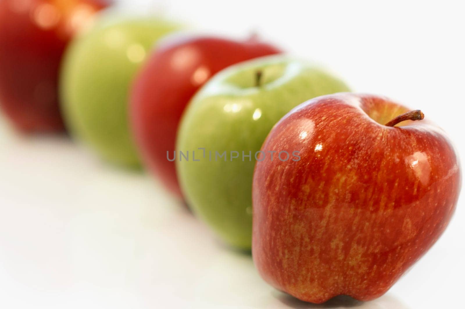 Close-up of an array of red and green apples