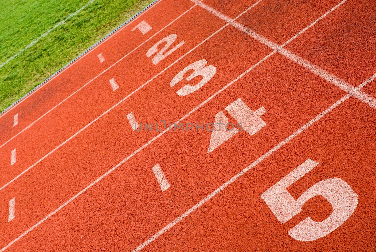 Close-up of track numbers on a running track