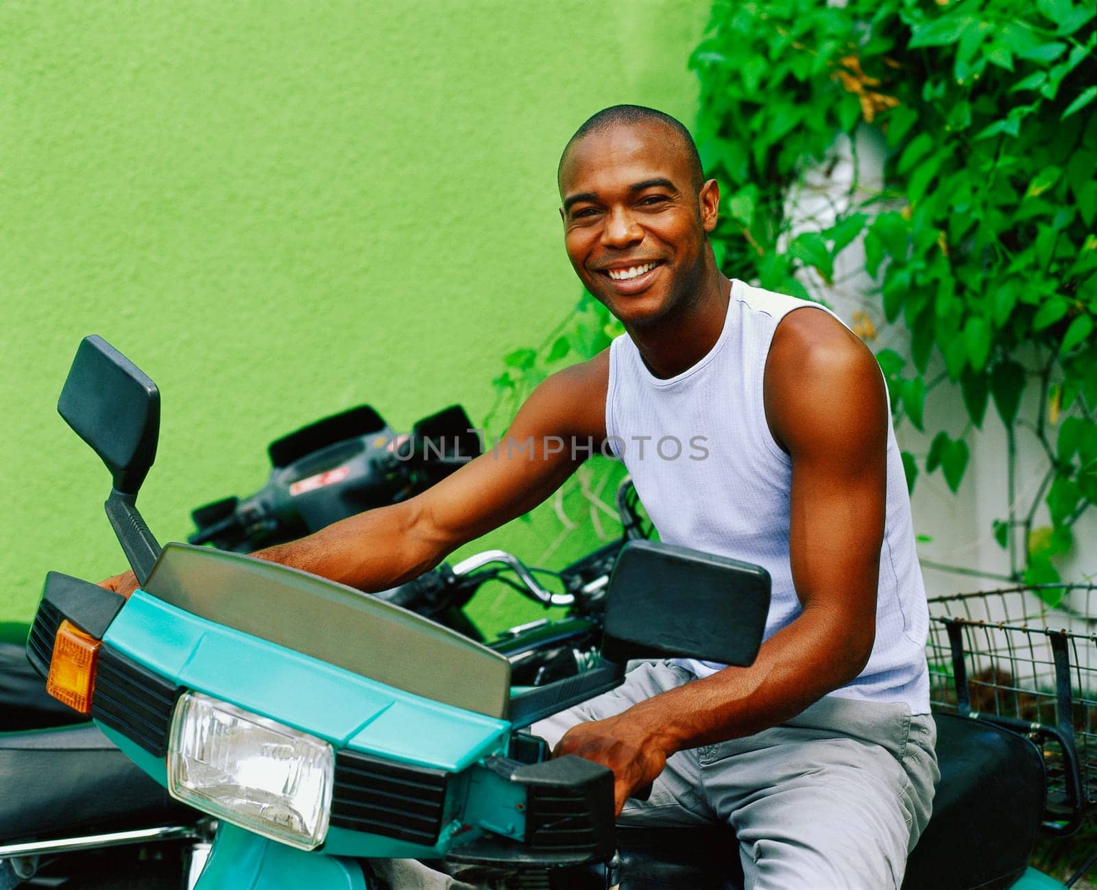 Portrait of a young man riding a scooter, Bermuda