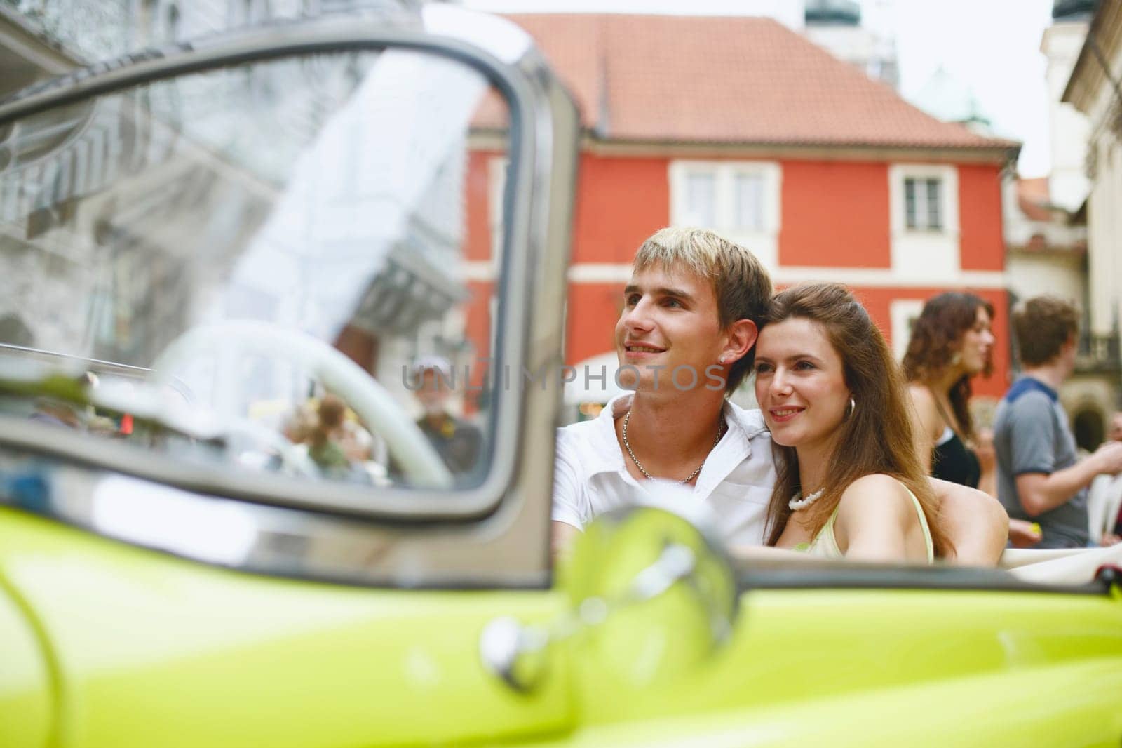 Young couple sitting in a car