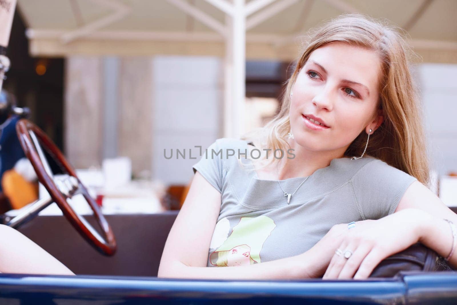 Close-up of a young woman in a car