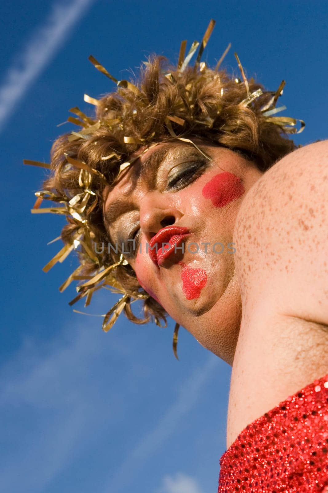 Low angle view of a mature man wearing a costume and puckering his lips