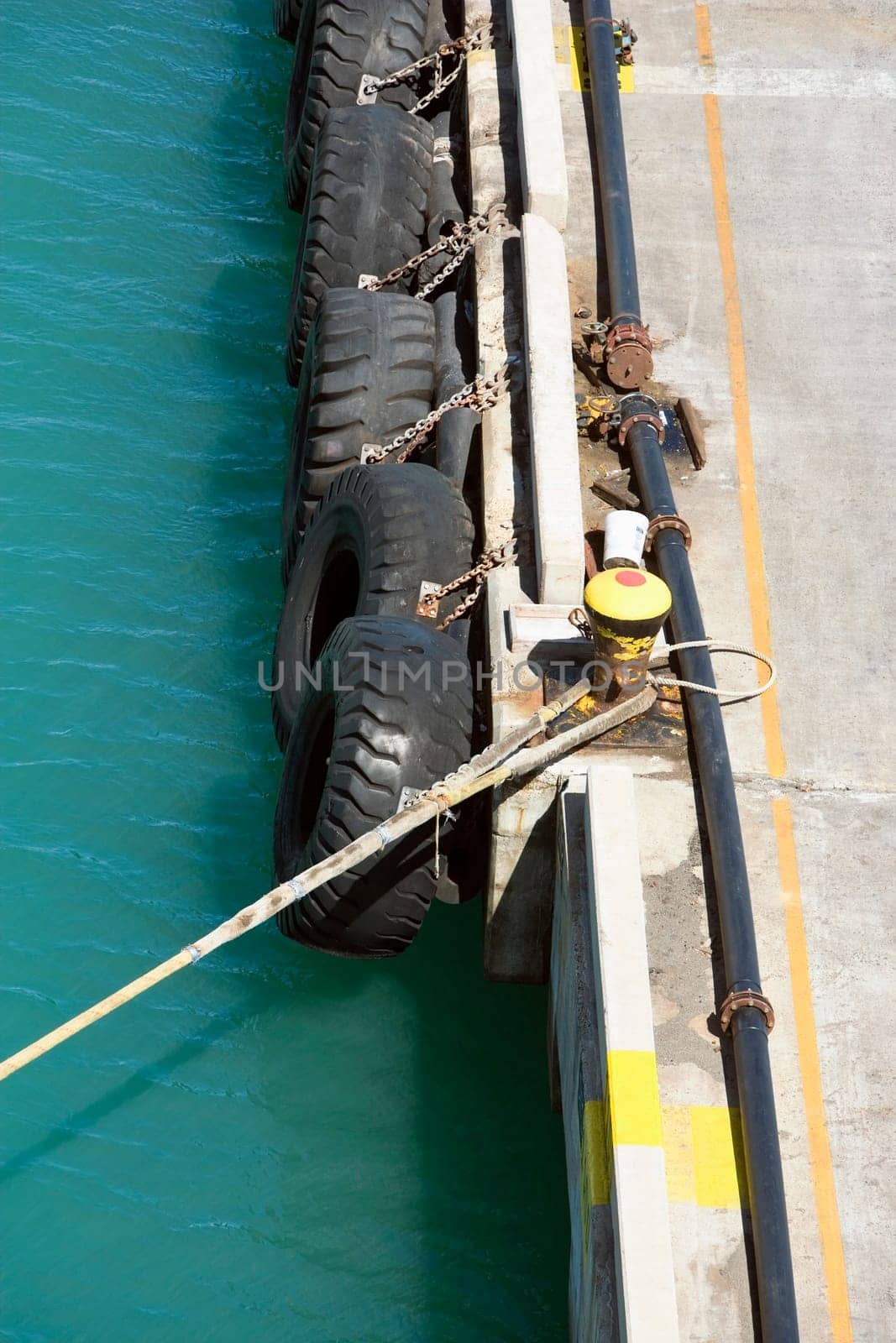 Close-up of a rope tied up with a bollard