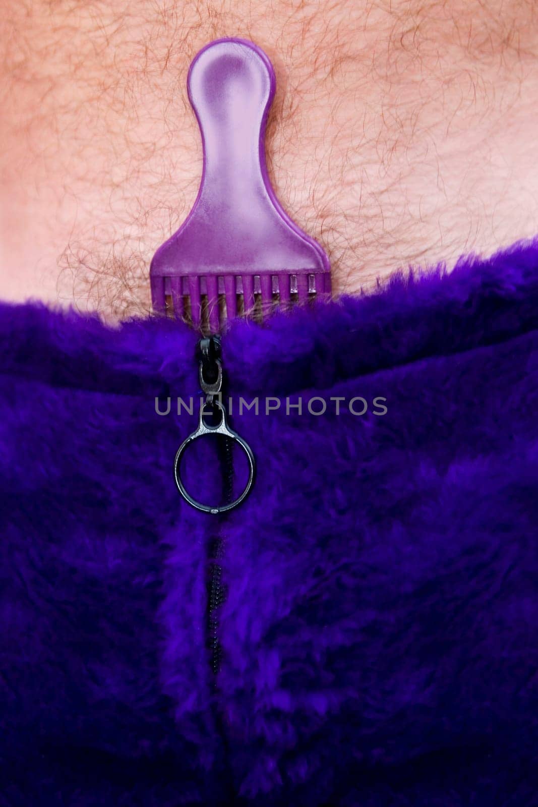 Close-up of a comb inserted in a clothing