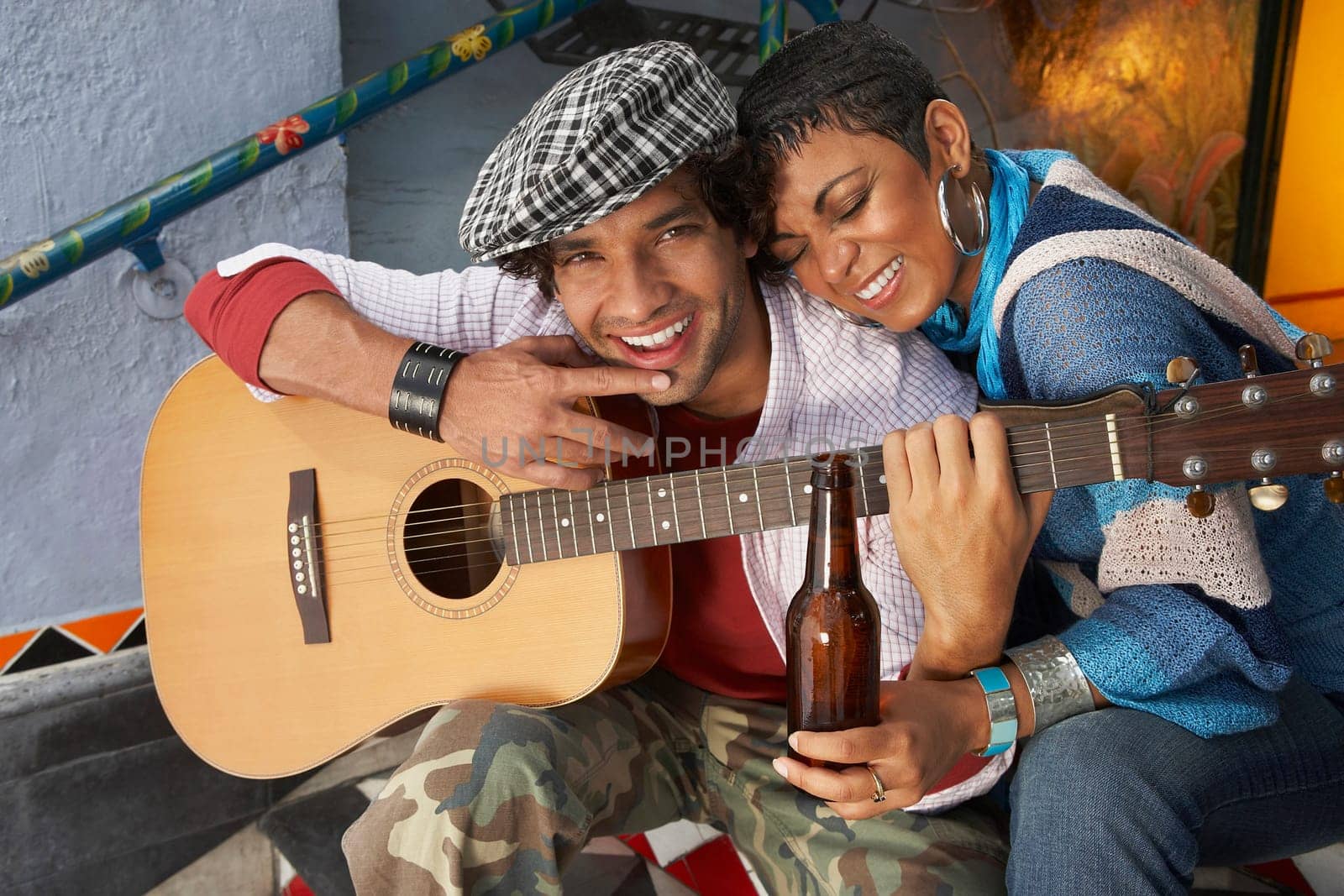 Close-up of a young man smiling with a young woman