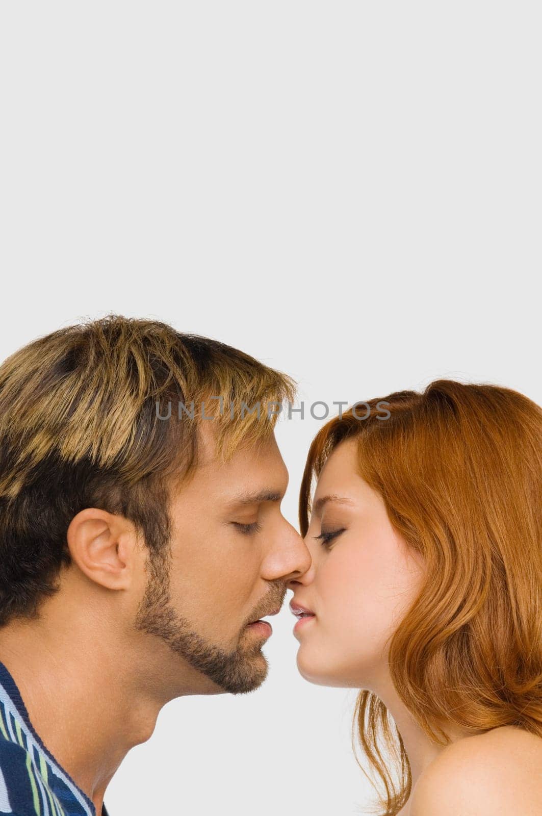 Side profile of a couple kissing each other