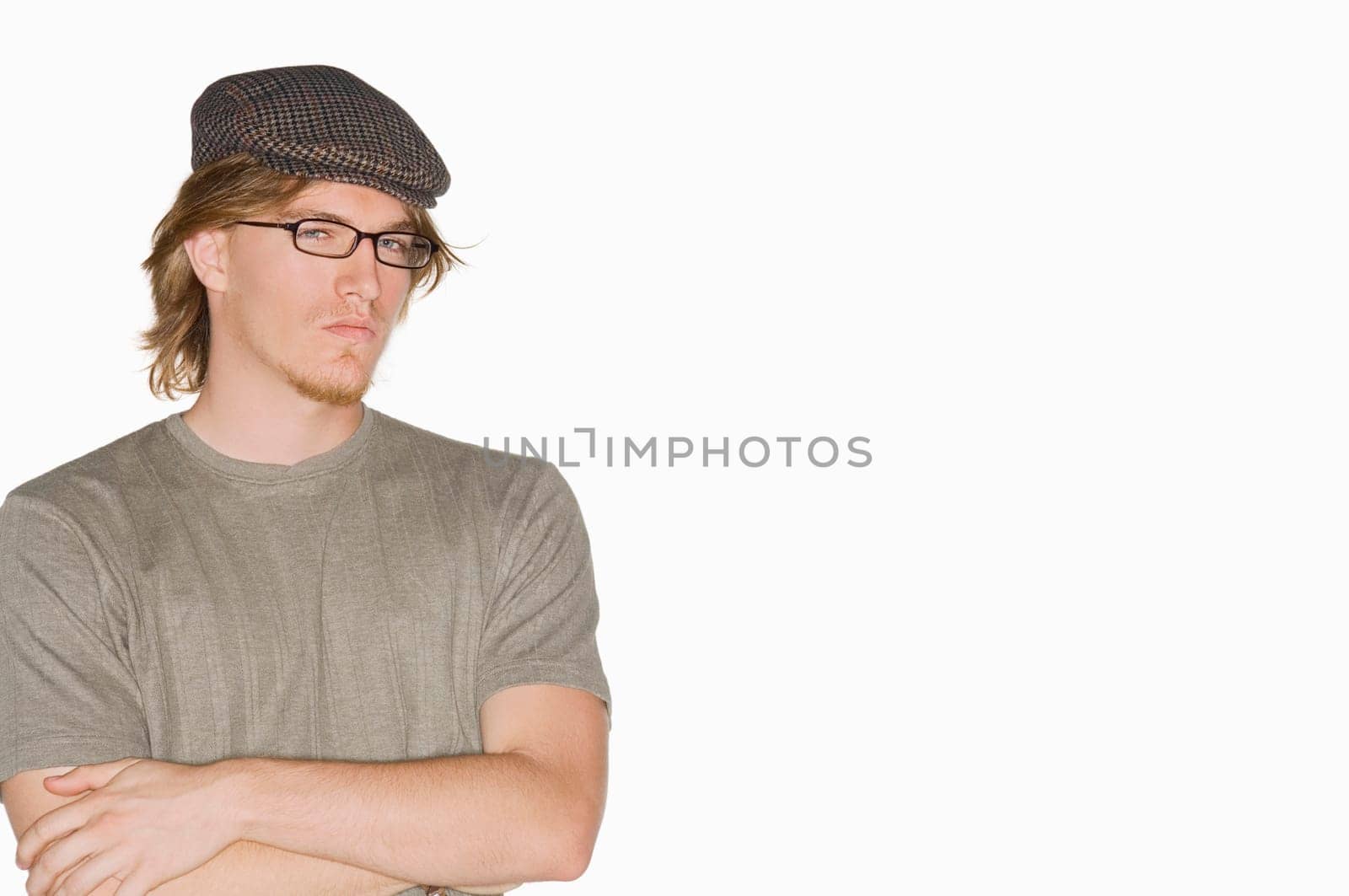 Portrait of a young man with his arms crossed