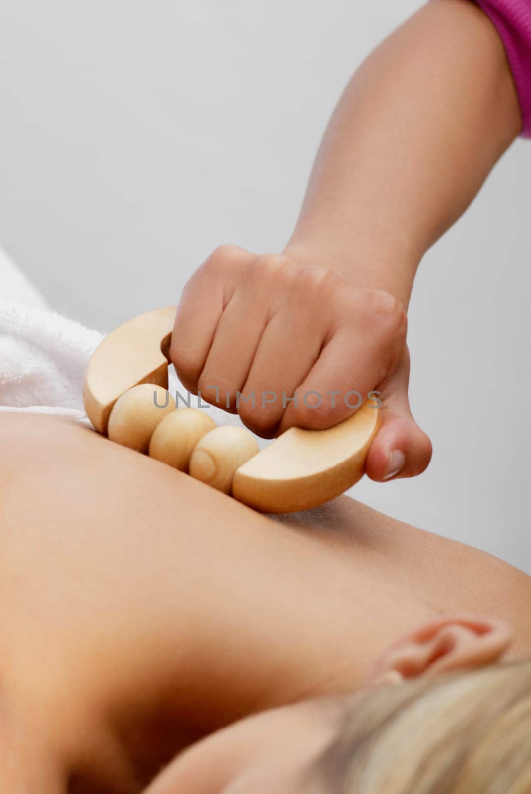 Close-up of a young woman getting a massage