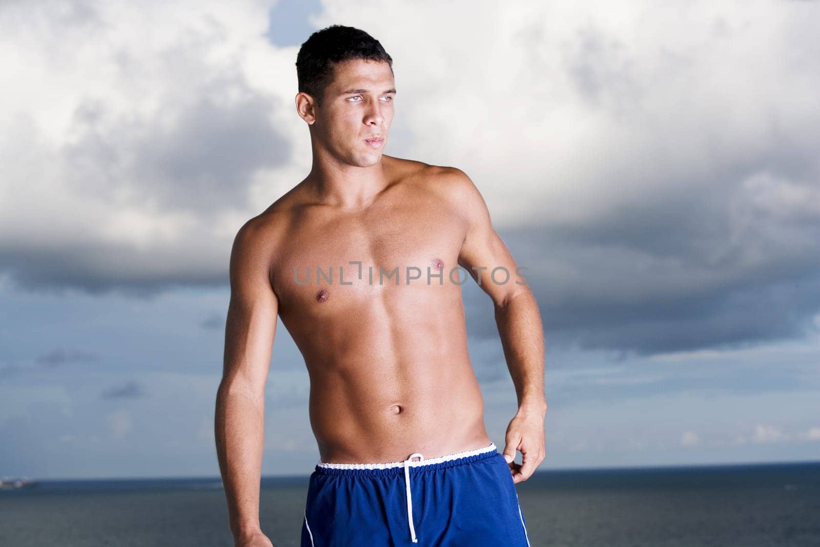 Young man standing bare chested