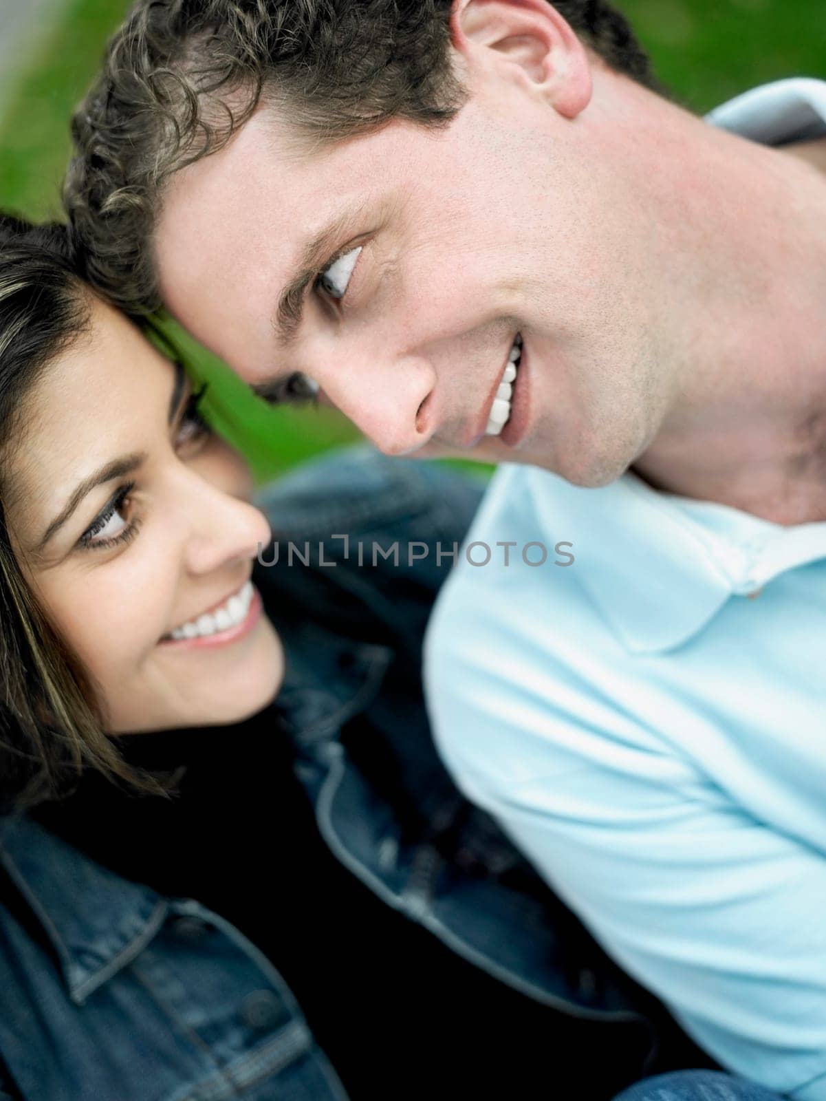 Close-up of a mid adult couple looking at each other and smiling