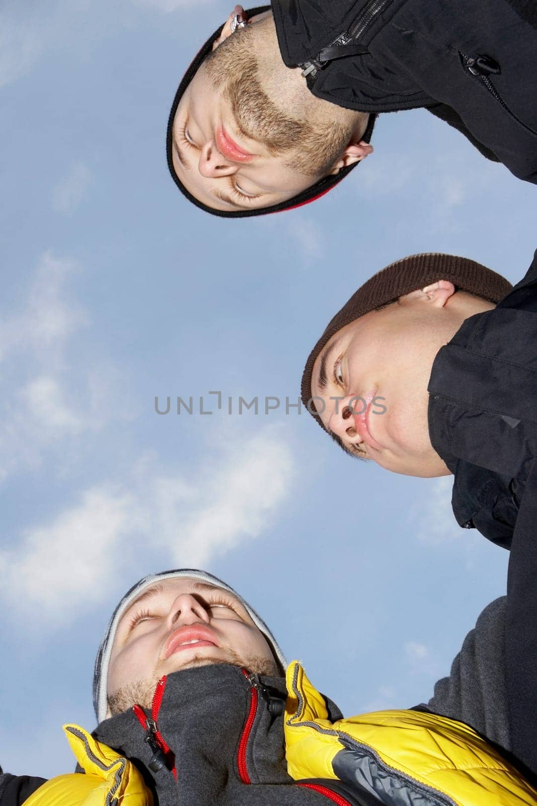 Low angle view of three young men
