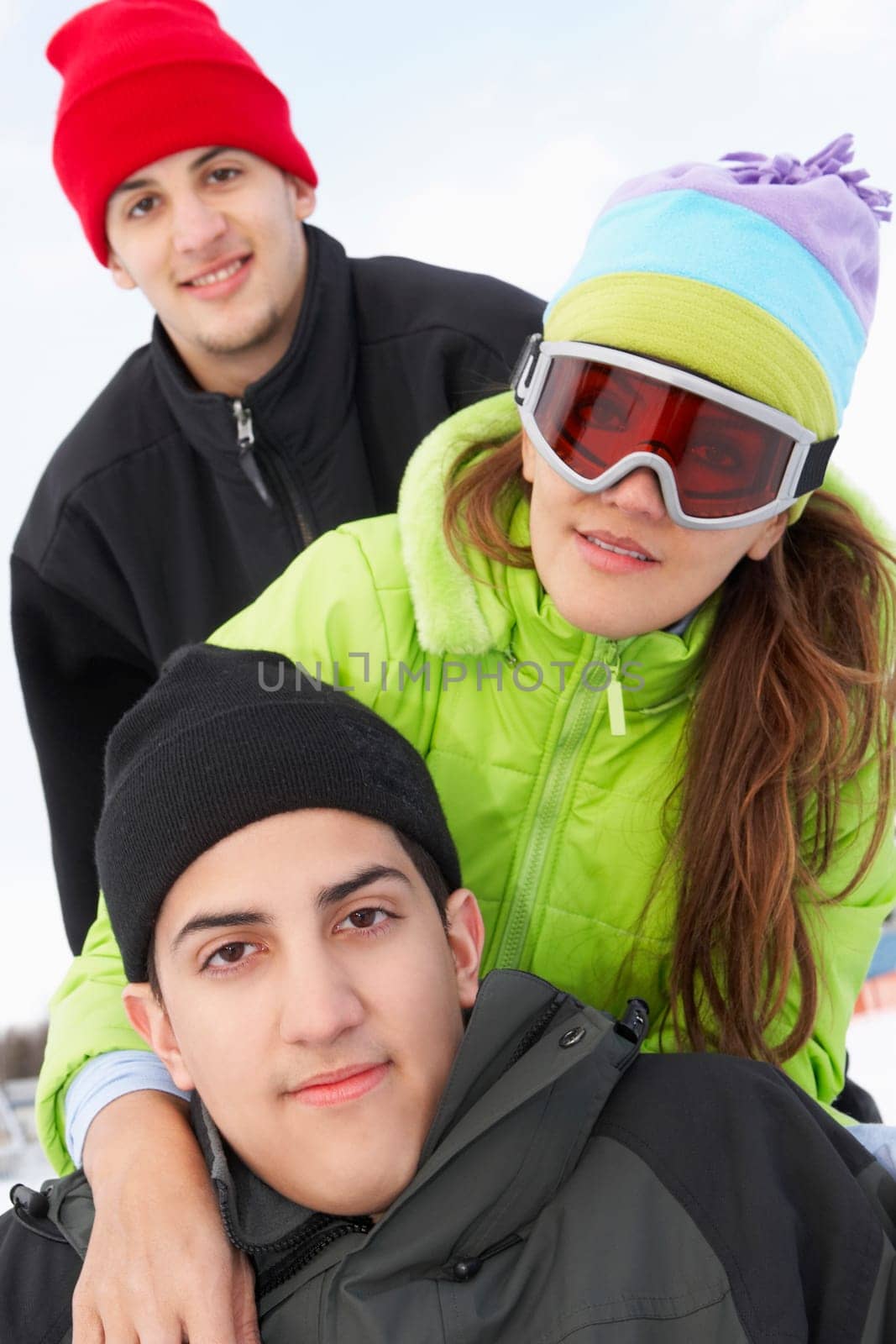 Three people smiling