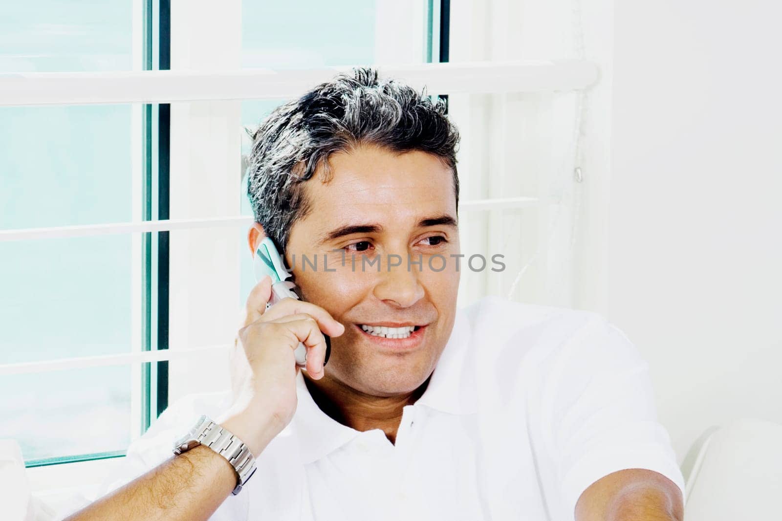 Close-up of a young man talking on a mobile phone