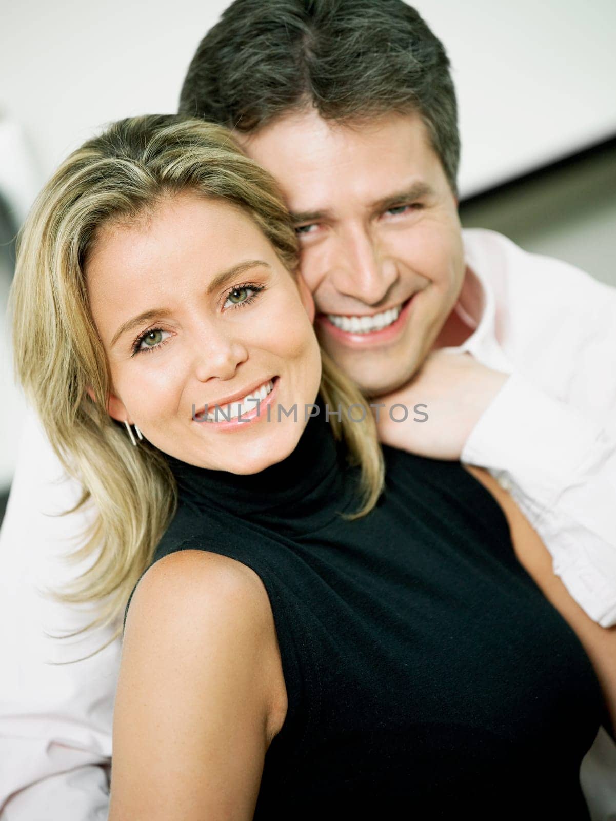Portrait of a mid adult woman and a mature man smiling