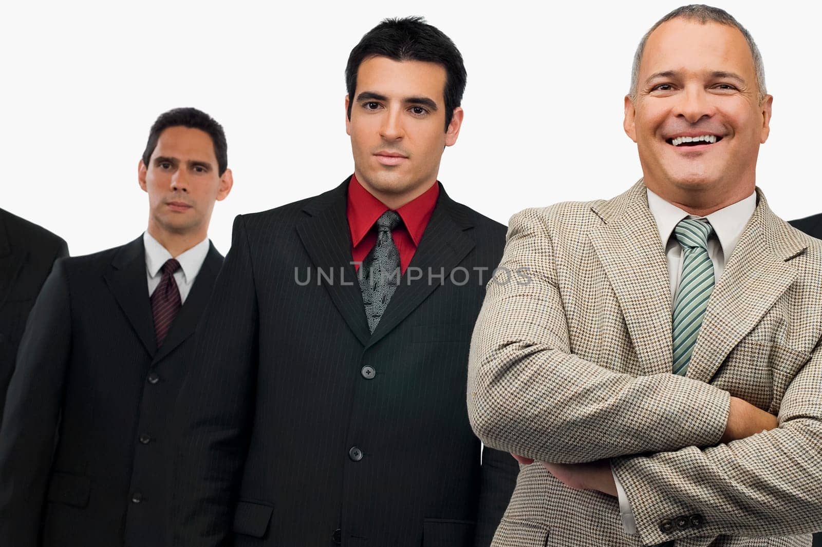 Portrait of a businessman smiling and three businessmen standing behind him