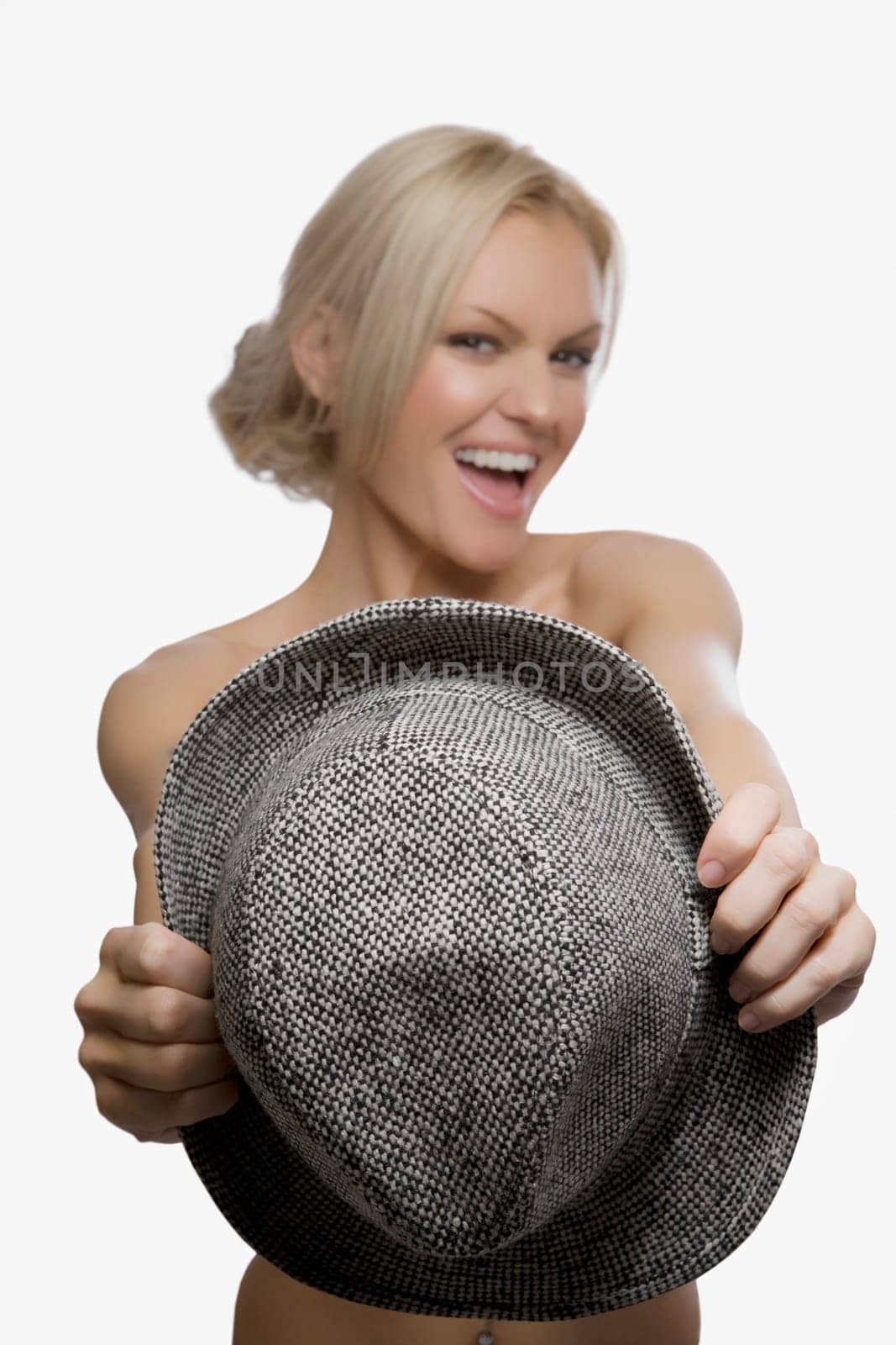 Portrait of a young woman holding a hat