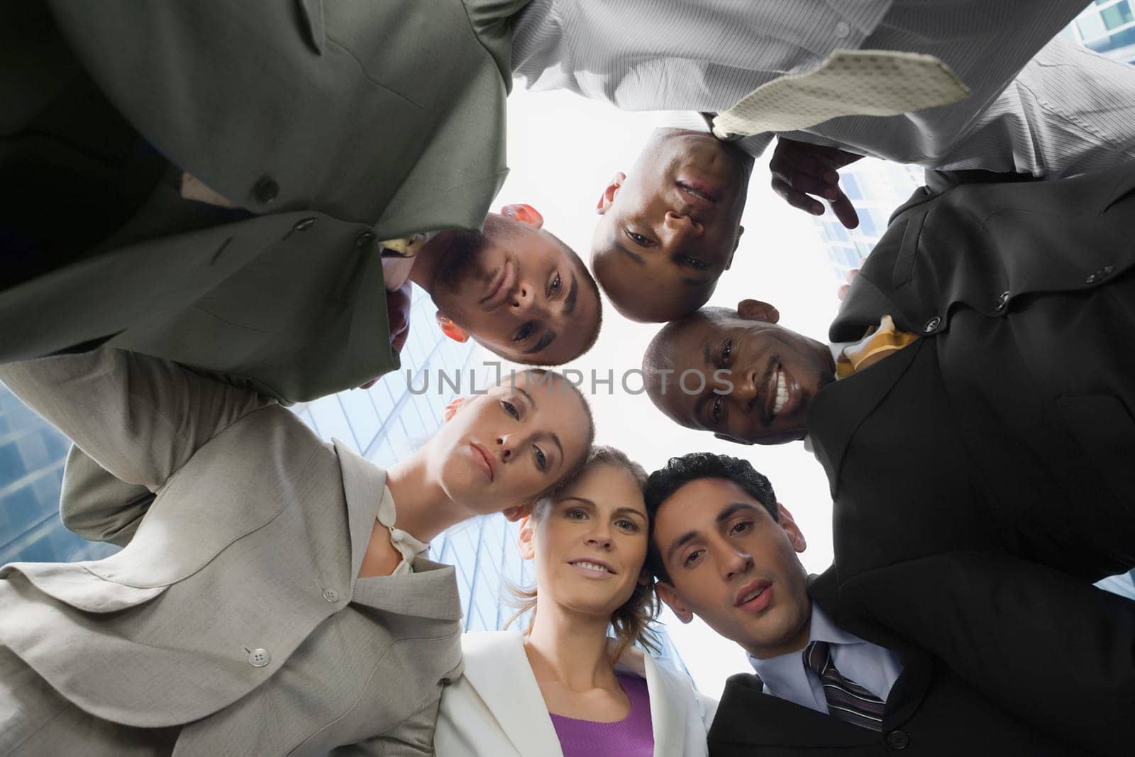 Low angle view of business executives standing in a huddle