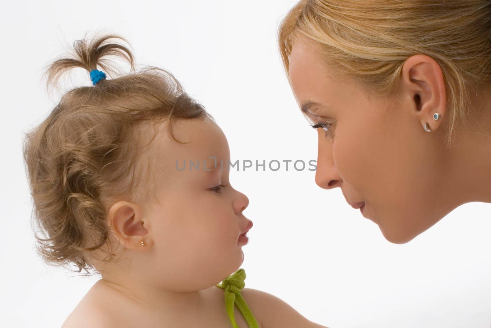 Close_up of a mid adult woman looking at her daughter