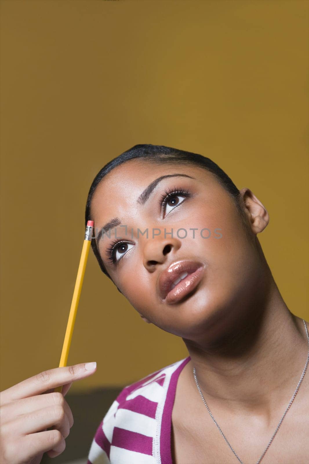 Close_up of a young woman thinking