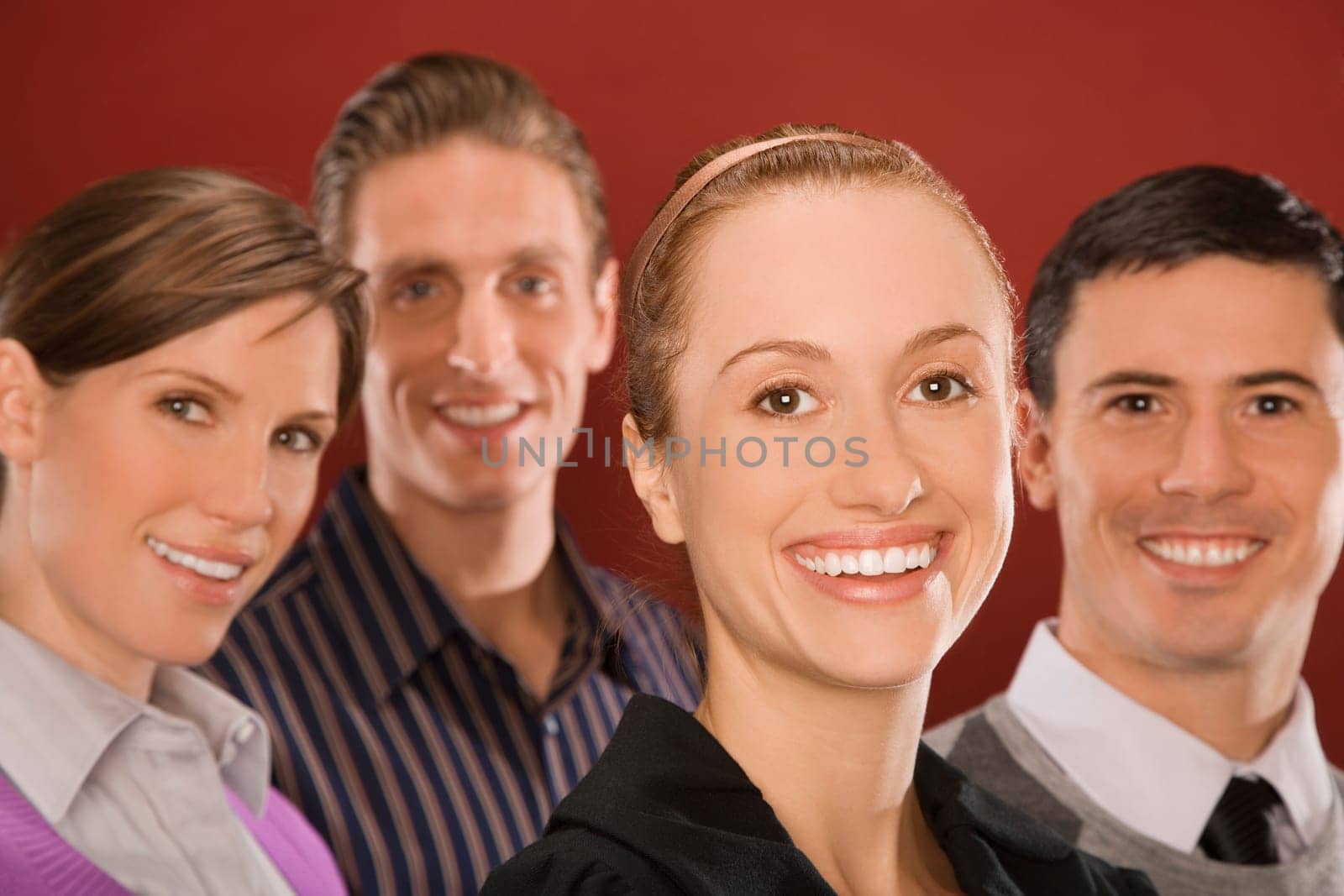 Portrait of four business executives smiling