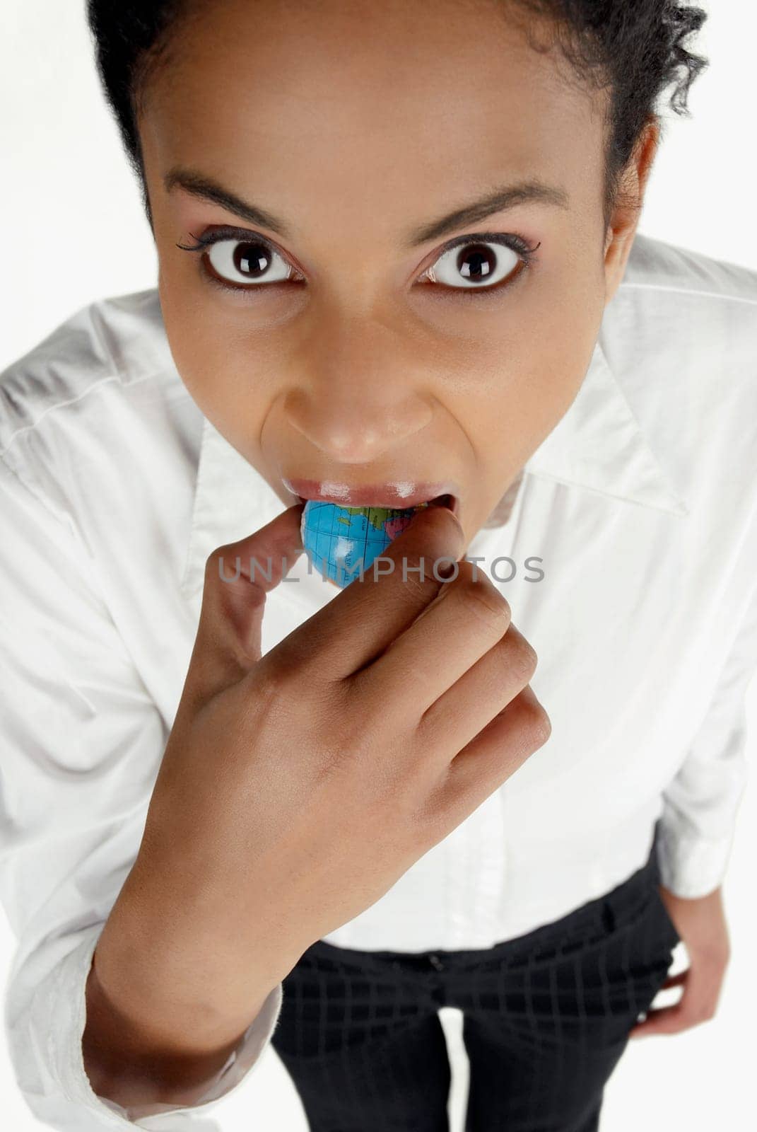 High angle view of a businesswoman holding a globe in her mouth