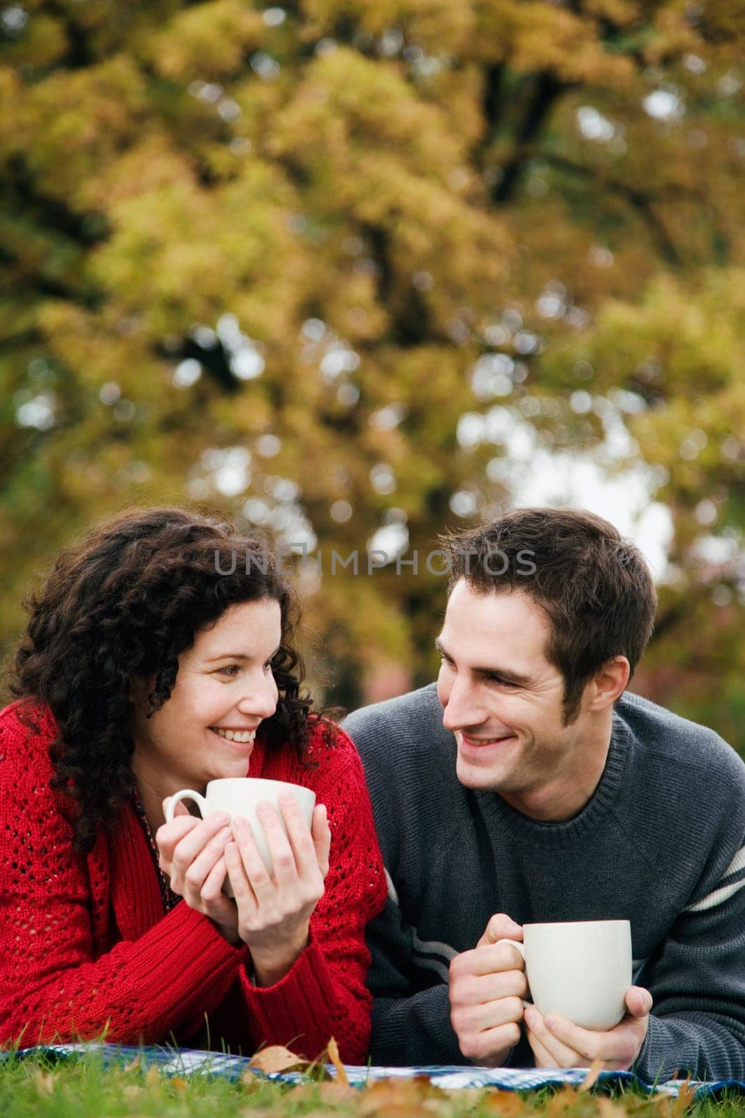 Couple having coffee in a lawn
