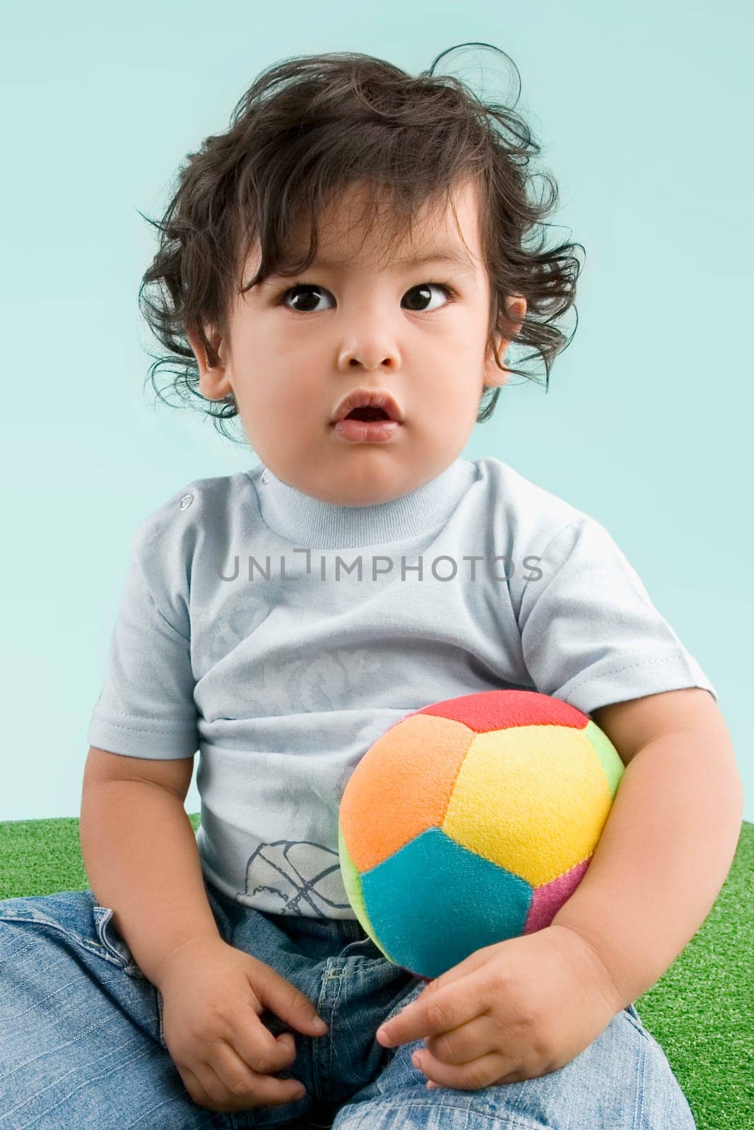 Close_up of a boy holding a ball