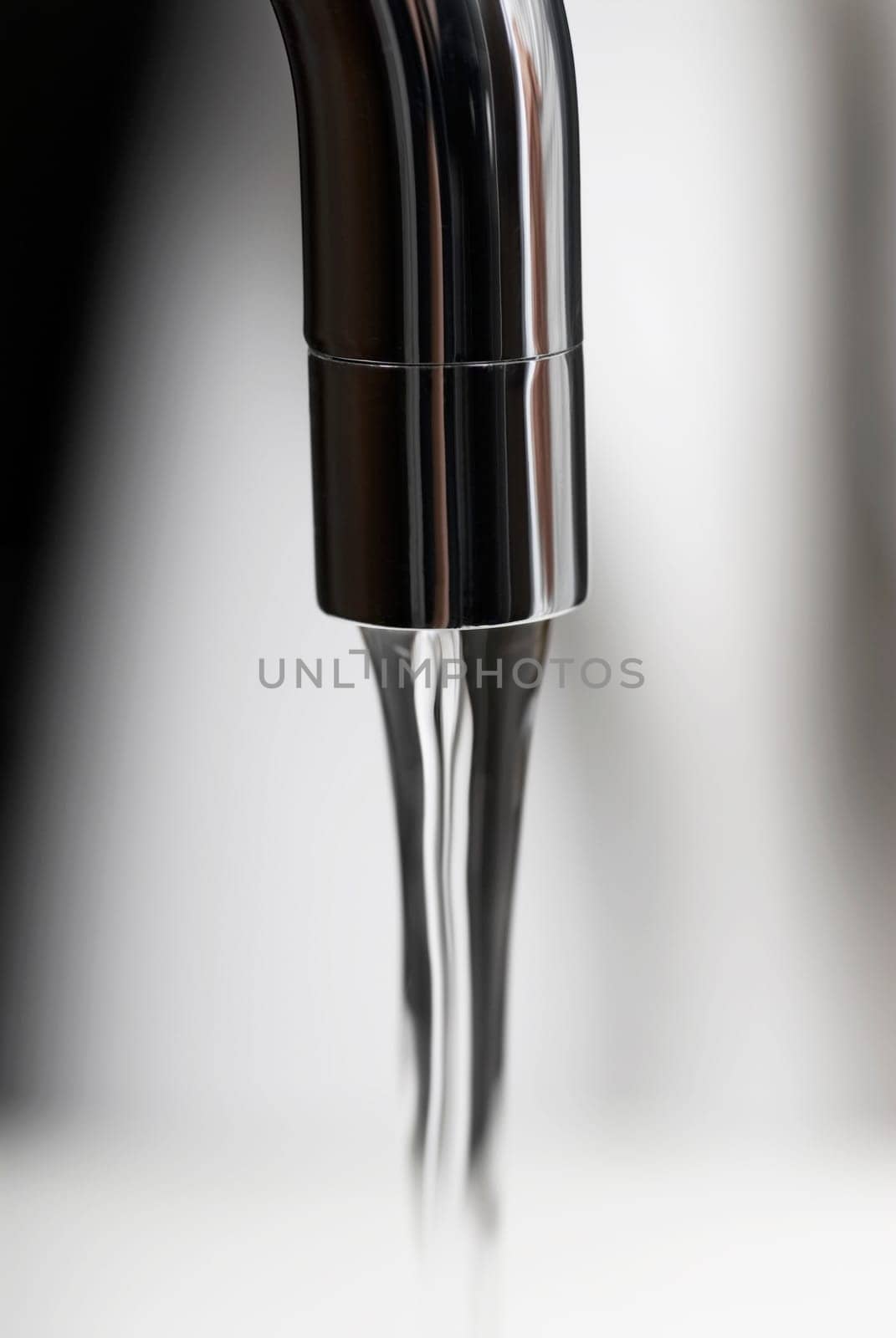 Water flowing out of a faucet