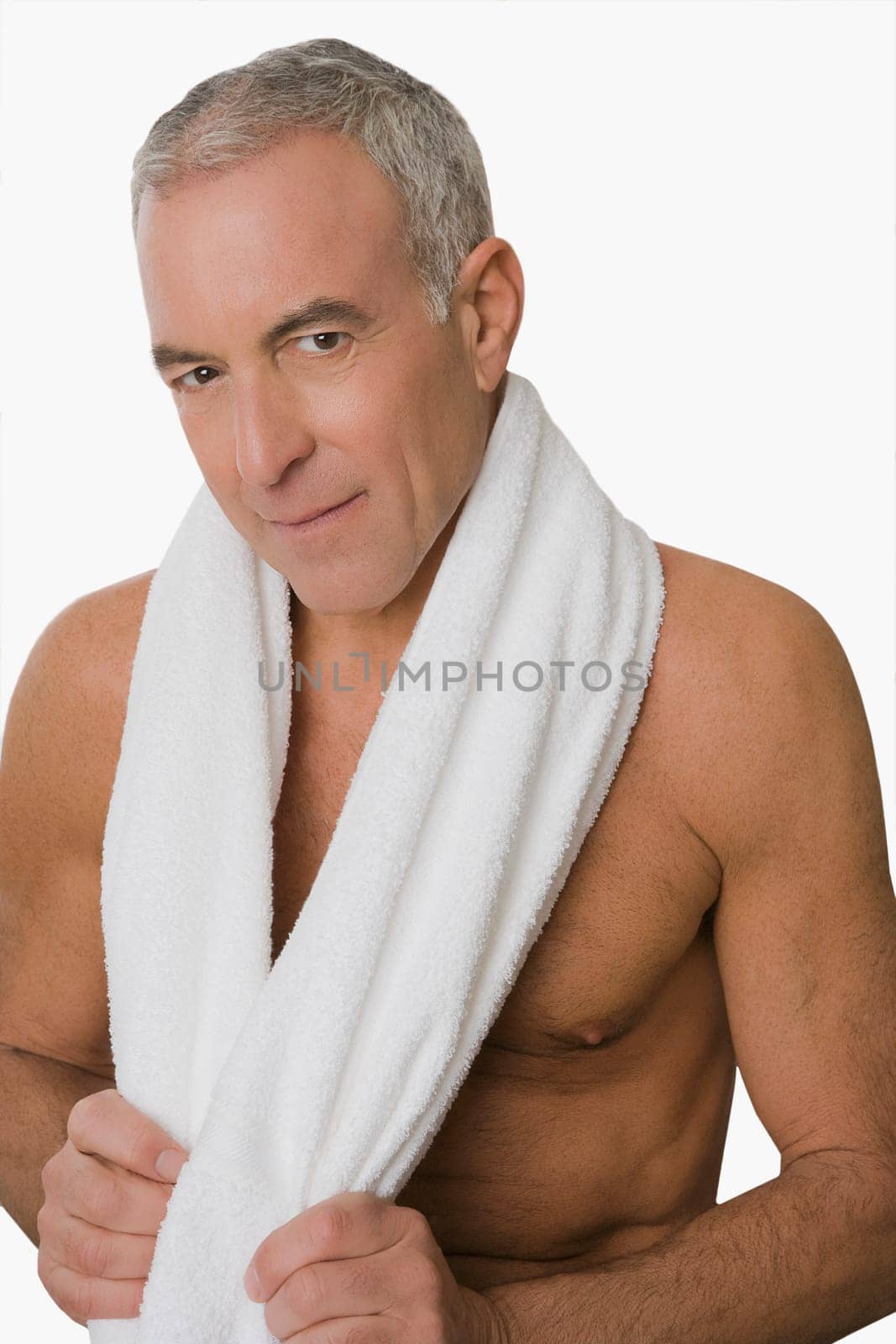 Portrait of a senior man smiling with a towel around his neck