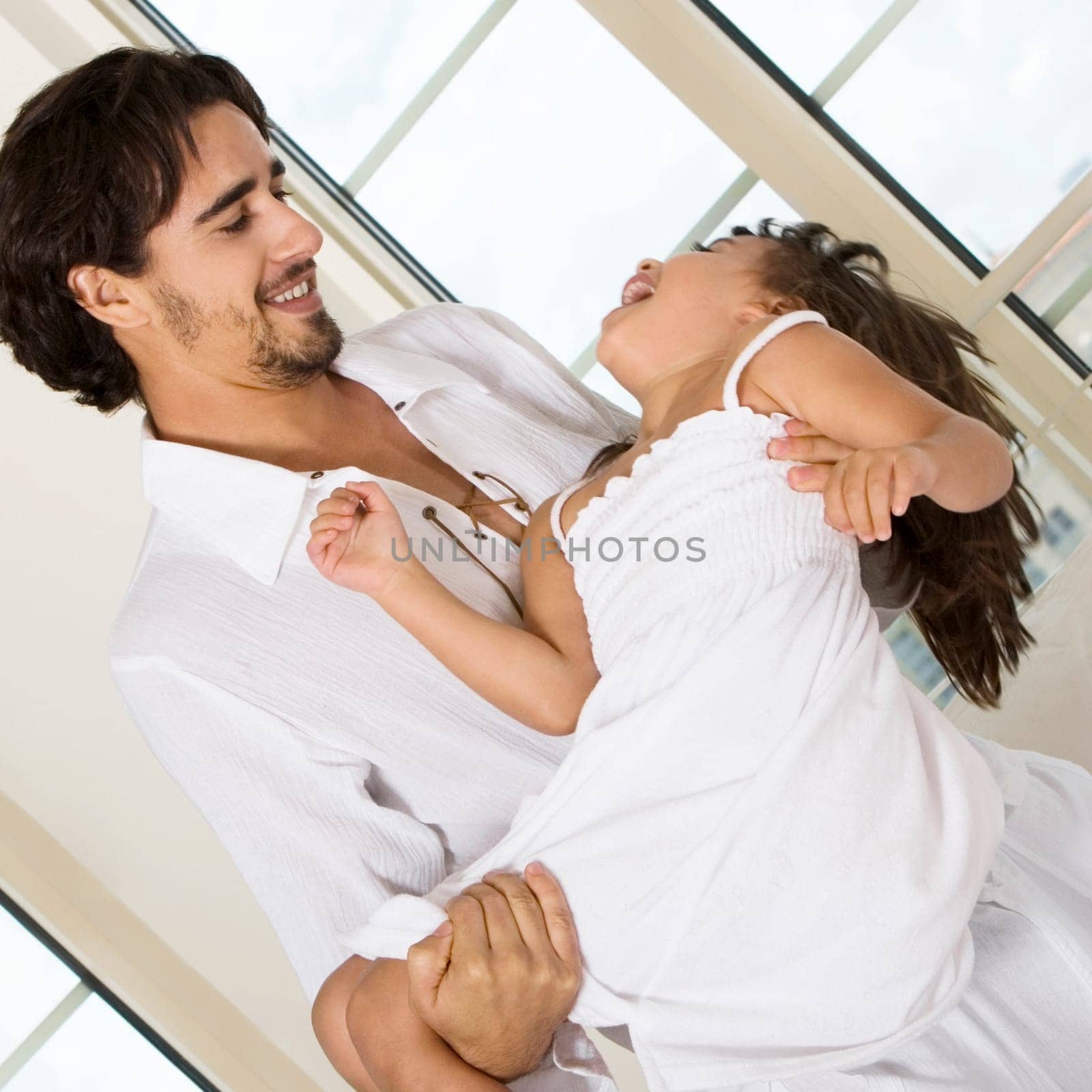 Close-up of a father carrying his daughter