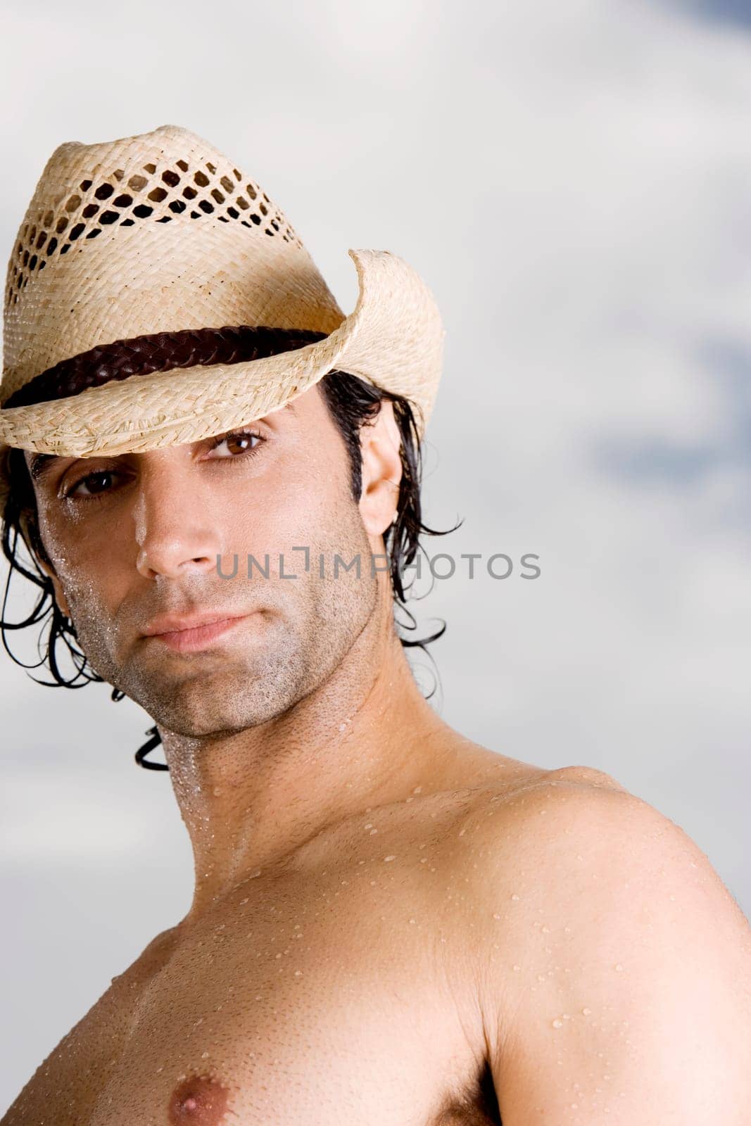 Low angle view of a mid adult man wearing a hat