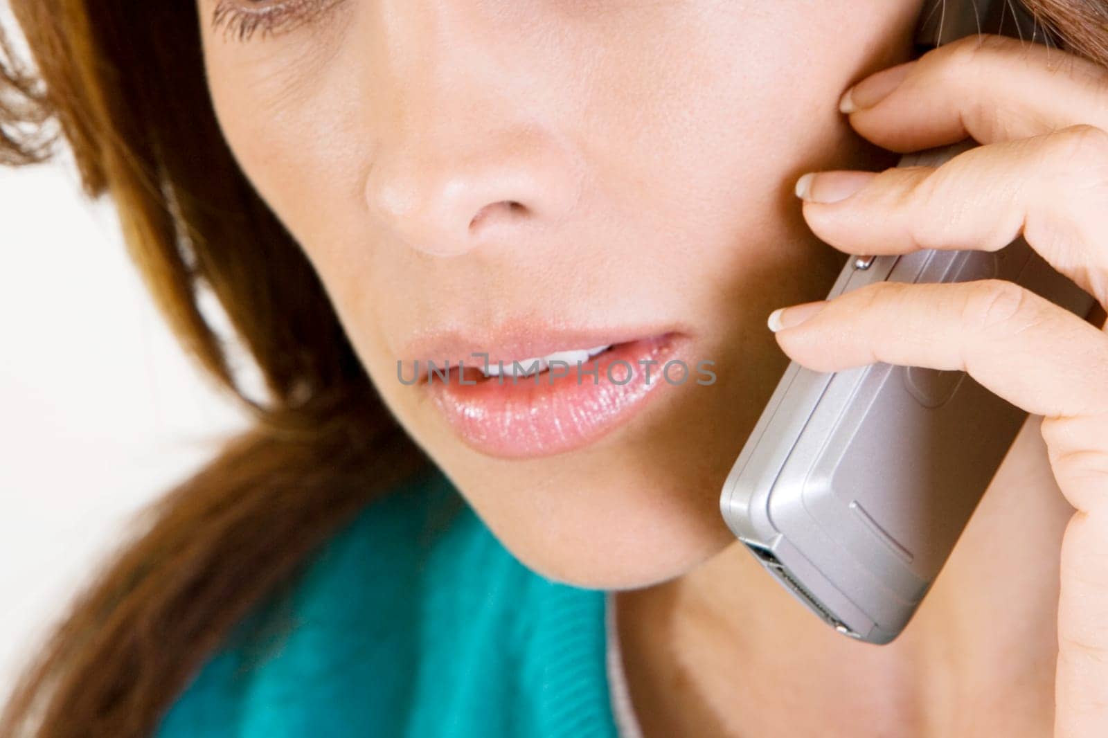 Close-up of a mid adult woman talking on a mobile phone