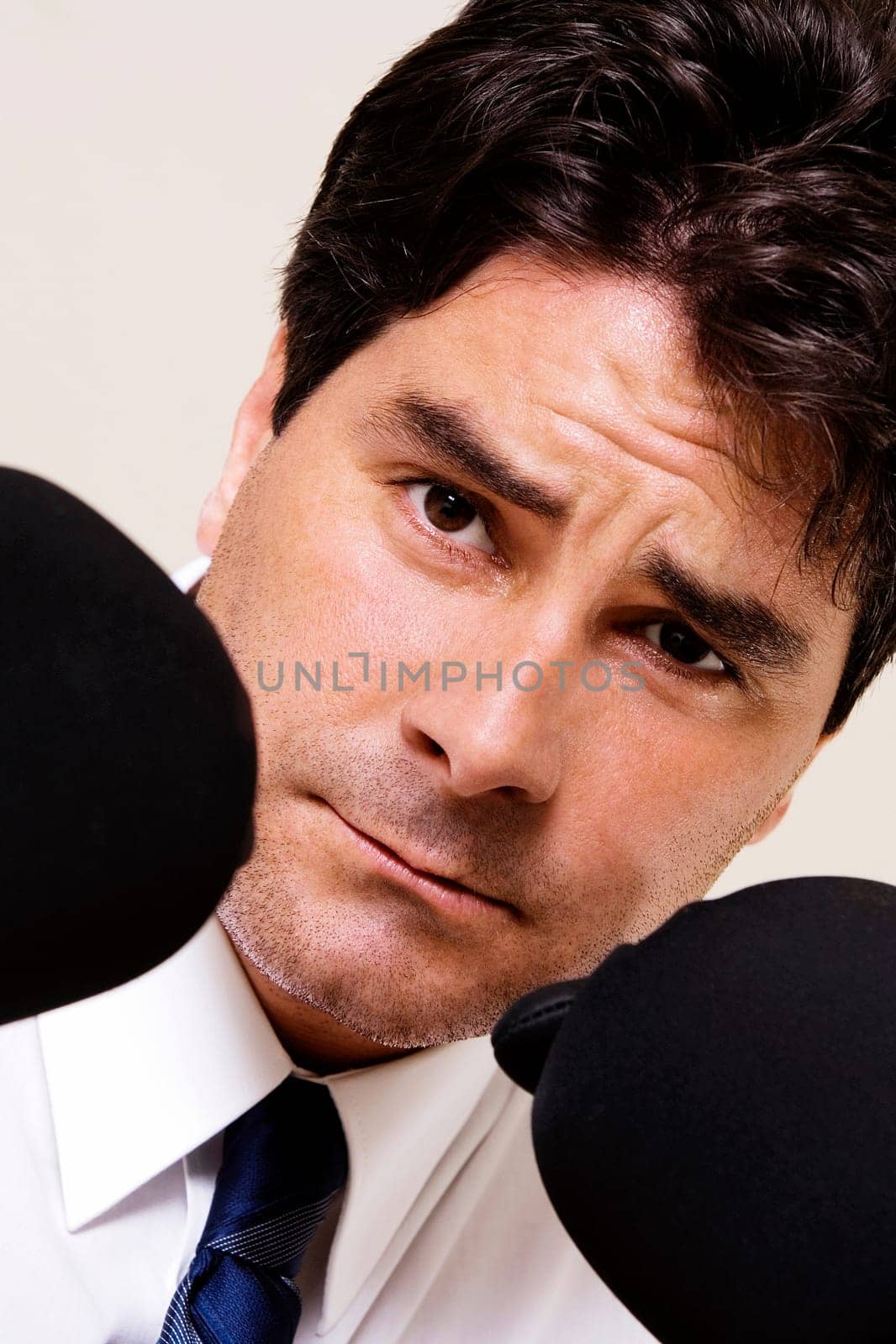 Portrait of a businessman wearing boxing gloves