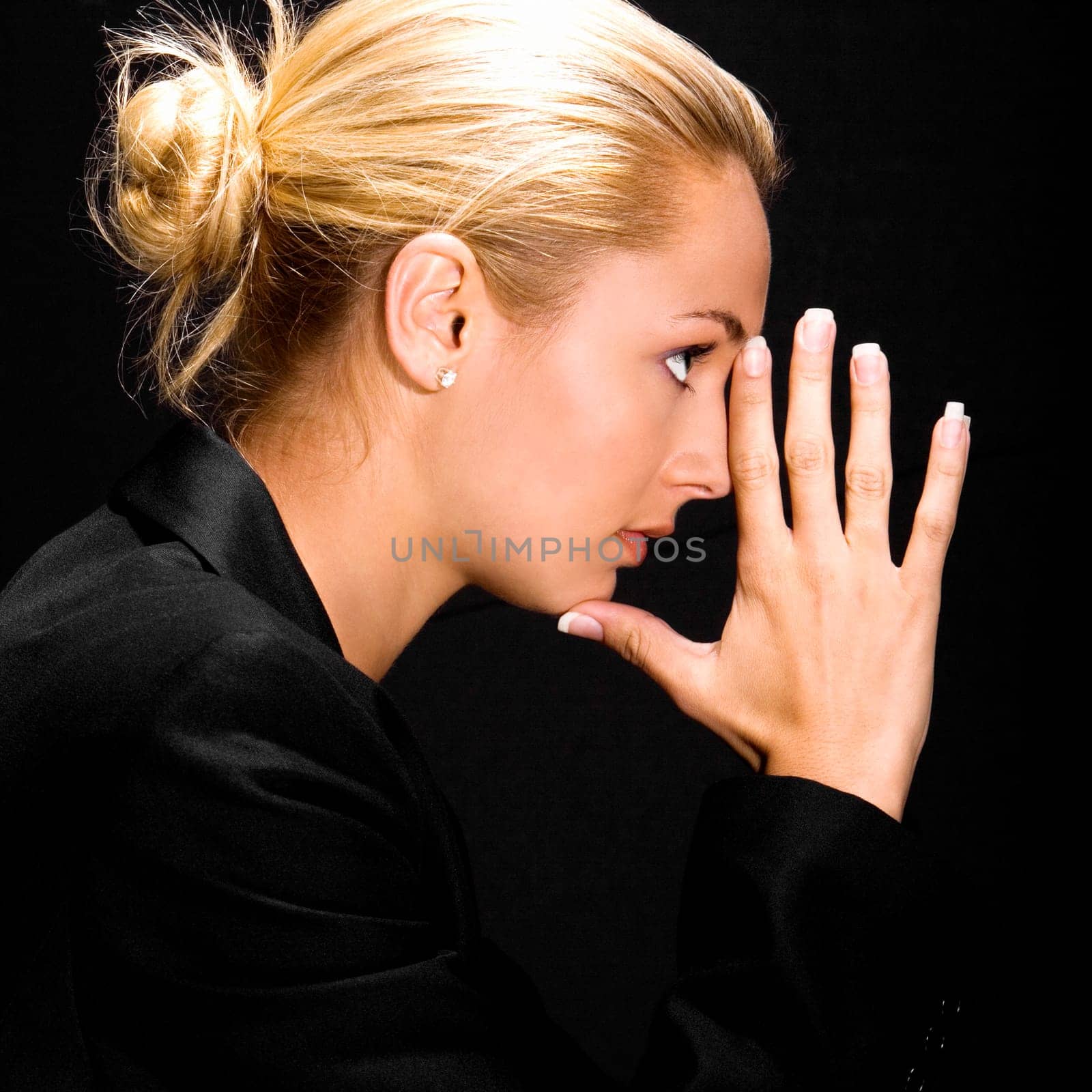 Side profile of a young woman thinking