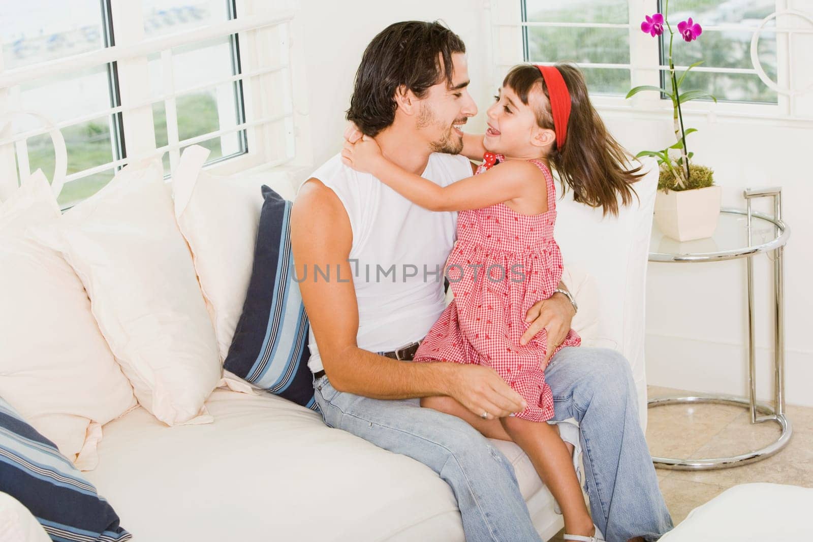 Side profile of a father hugging his daughter