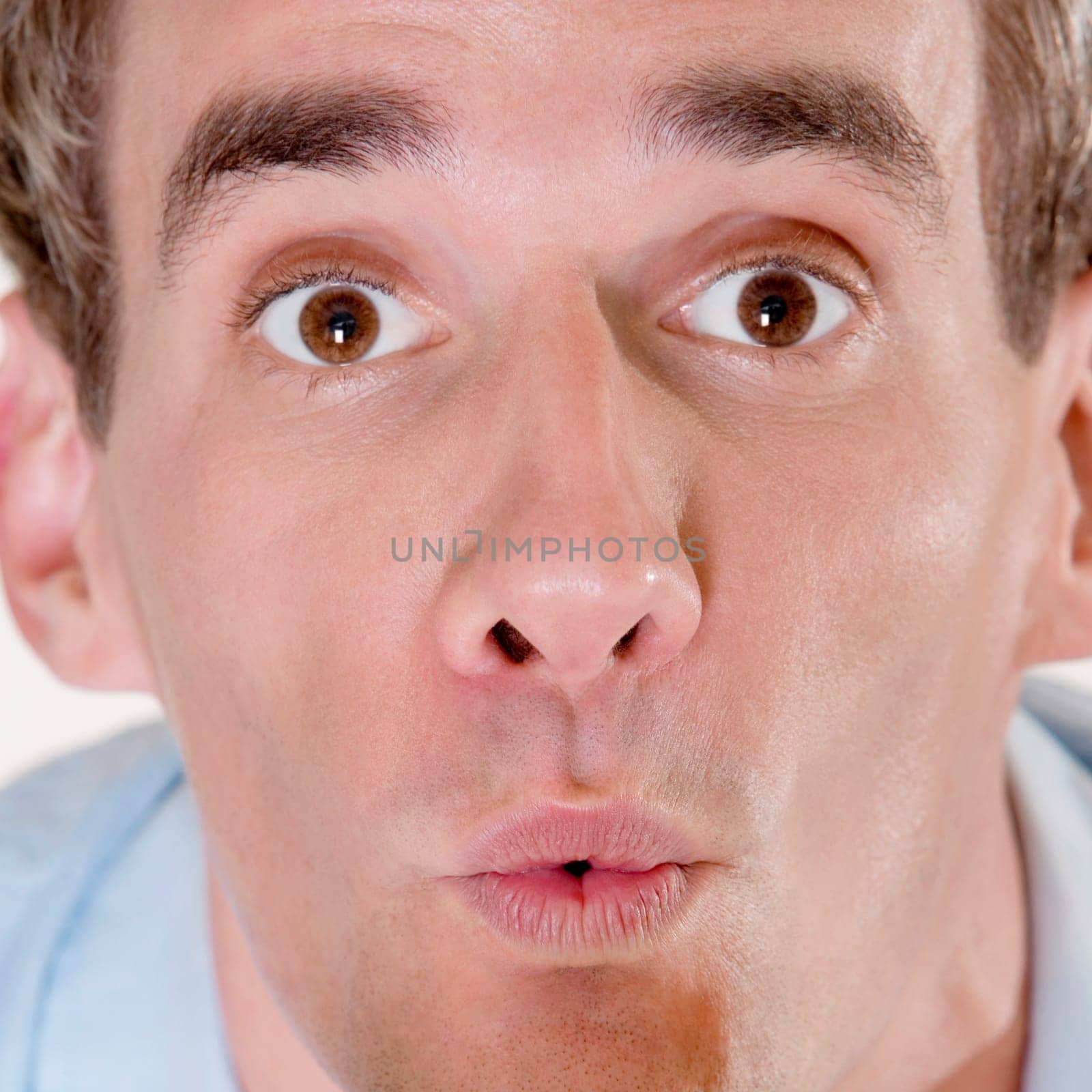 Portrait of a mid adult man looking surprised
